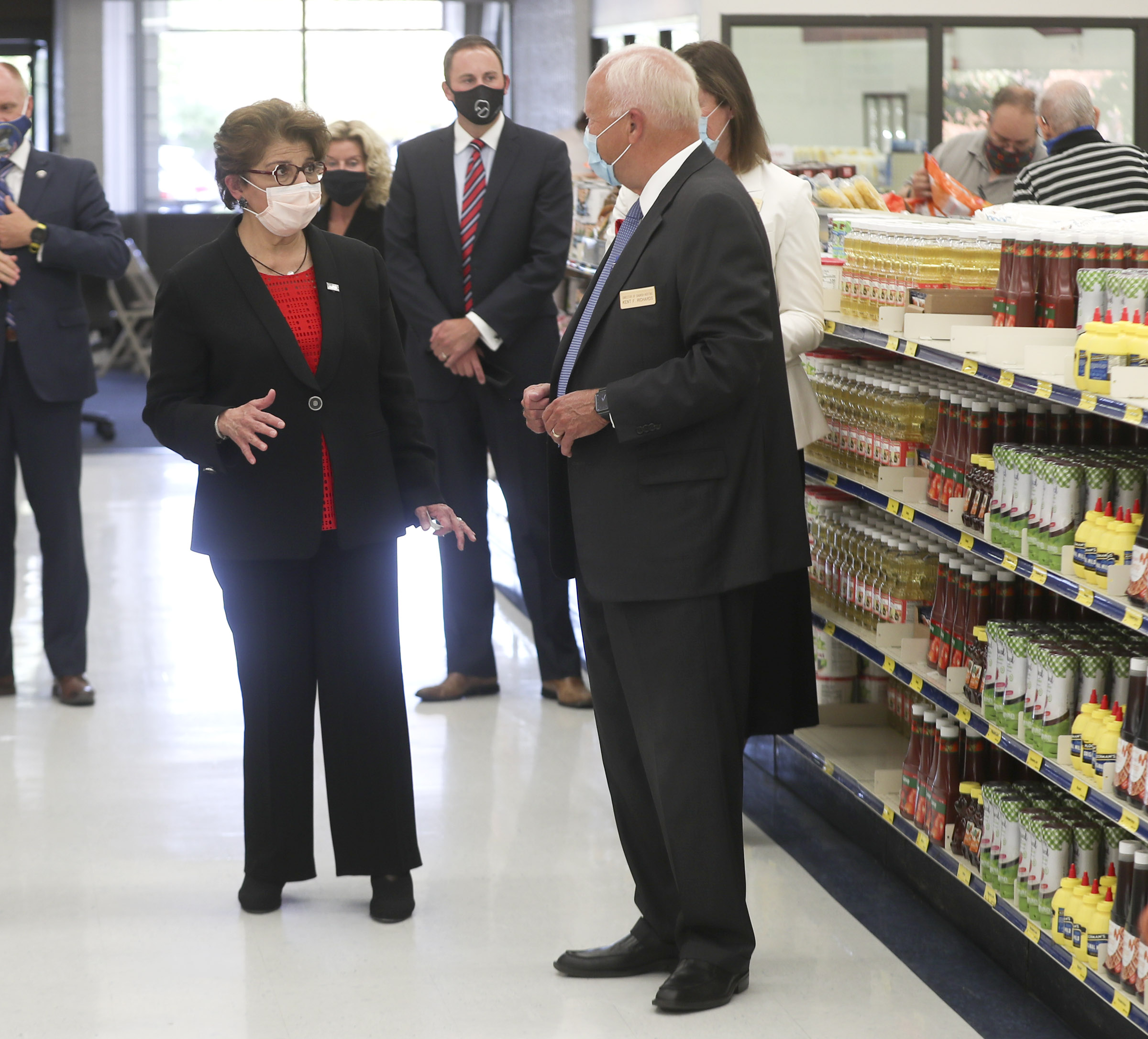 Jovita Carranza, administrator of the U.S. Small Business Administration, left, talks with Elder Kent F. Richards, director of hosting for The Church of Jesus Christ of Latter-day Saints, during a tour of Welfare Square in Salt Lake City on Wednesday, Aug. 19, 2020.