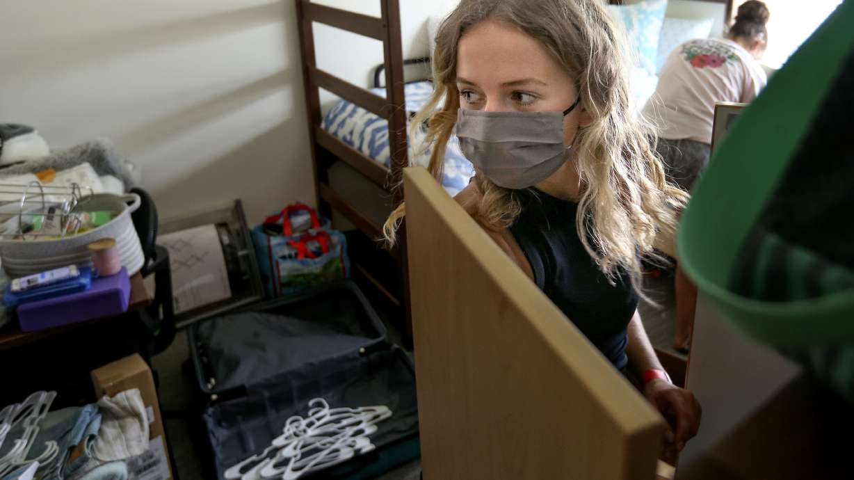 Victoria Medvedeva, of Idaho Falls, unpacks her belongings in her dorm room in Kahlert Village at the University of Utah in Salt Lake City on Thursday, Aug. 20, 2020.