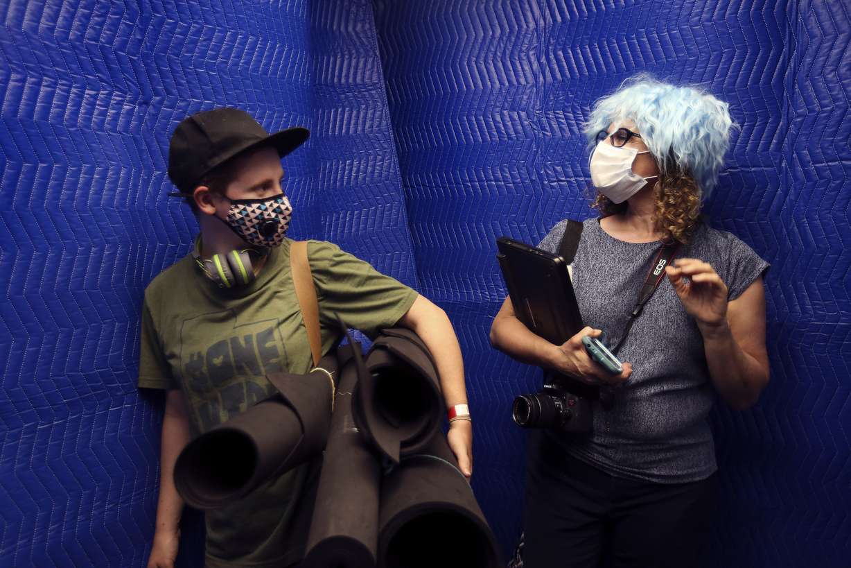 Rose Robrecht, of Ogden, left, laughs at her mother, Kristin Jamieson, as she wears one of Roseâs Cosplay wigs during move-in day at Kahlert Village at the University of Utah in Salt Lake City on Thursday, Aug. 20, 2020.