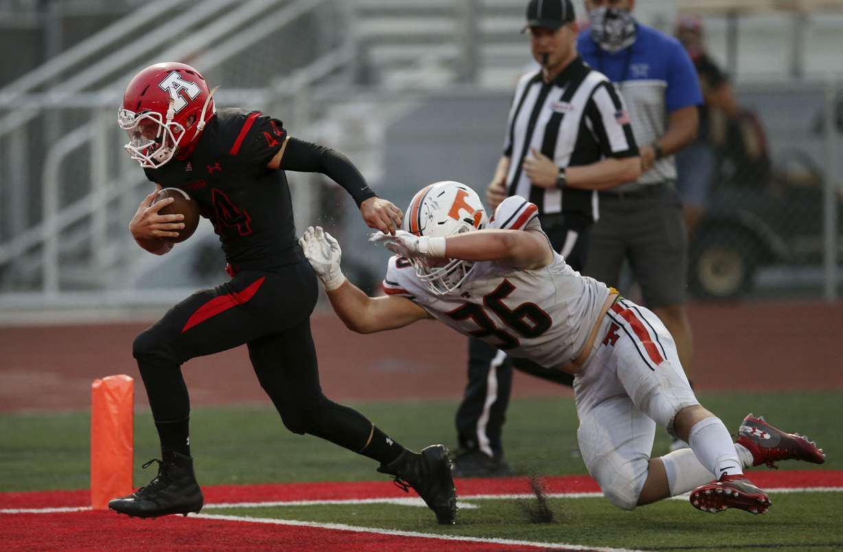 American ForkâsSpike Adams (44) runs into the end zone to score against Timpviewâ Cael Richardson (36) at American Fork High School in American Fork on Thursday, Aug. 20, 2020.