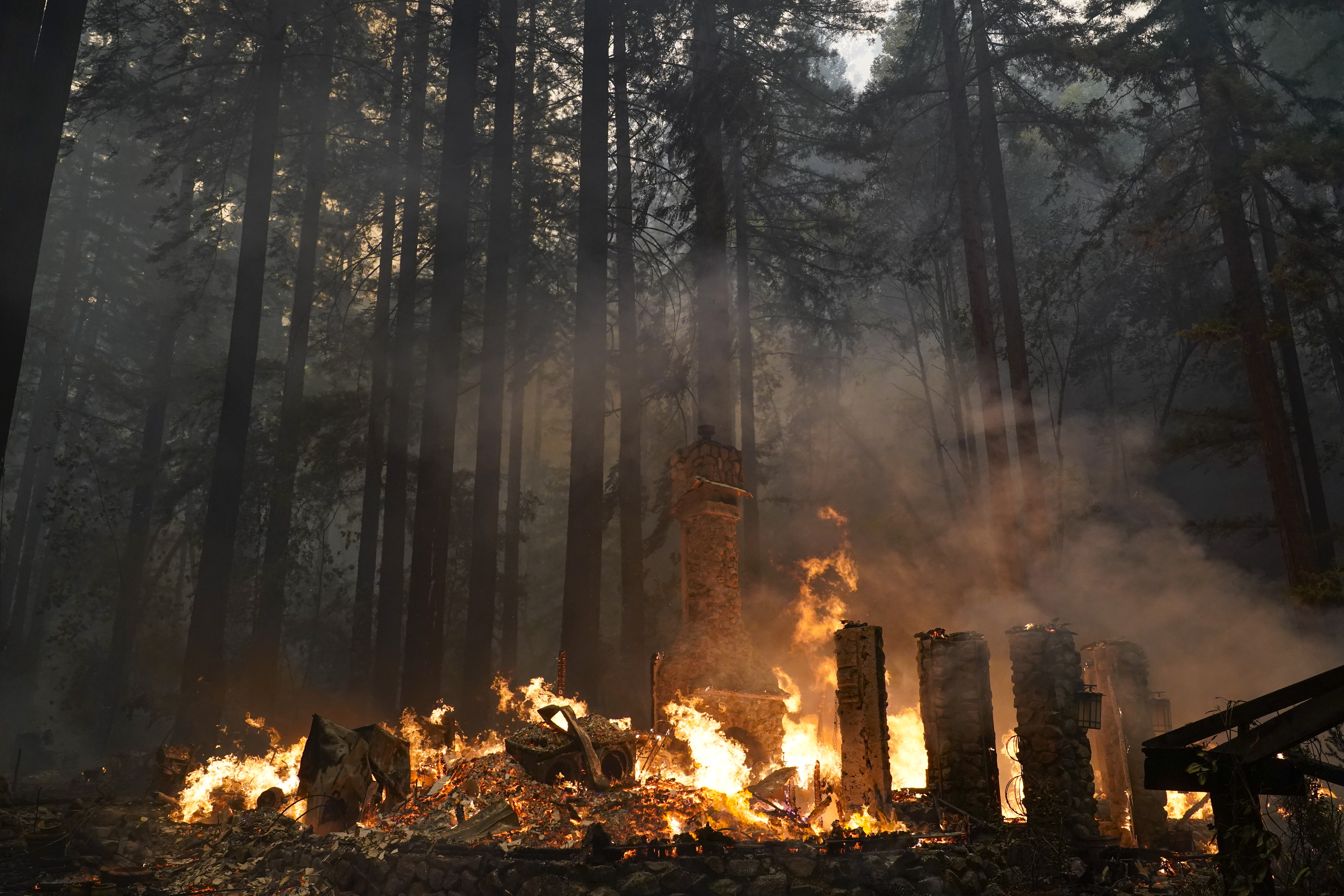 A home is burned to the ground by the CZU August Lightning Complex Fire, Thursday, Aug. 20, 2020, in Ben Lomond, Calif. (AP Photo/Marcio Jose Sanchez) [Aug-20-2020]
