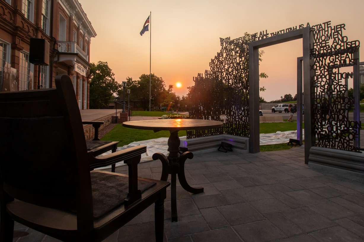 The chairs and tea table at the new women's history memorial outside of the Salt Lake Council Hall building. The table references the origin of the national suffrage movement in 1848 and the chairs are replicas of the chairs Utah officials sat in as they included women's suffrage in the drafting of the Utah State constitution in 1895. An engraving of the suffrage article is on the table.