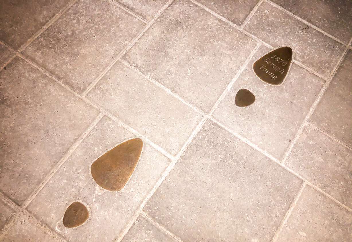 Bronze footprints commemorating Seraph Young's historic vote in 1870. Young was the first woman to vote in an election open to men and women in the modern U.S. voting era.