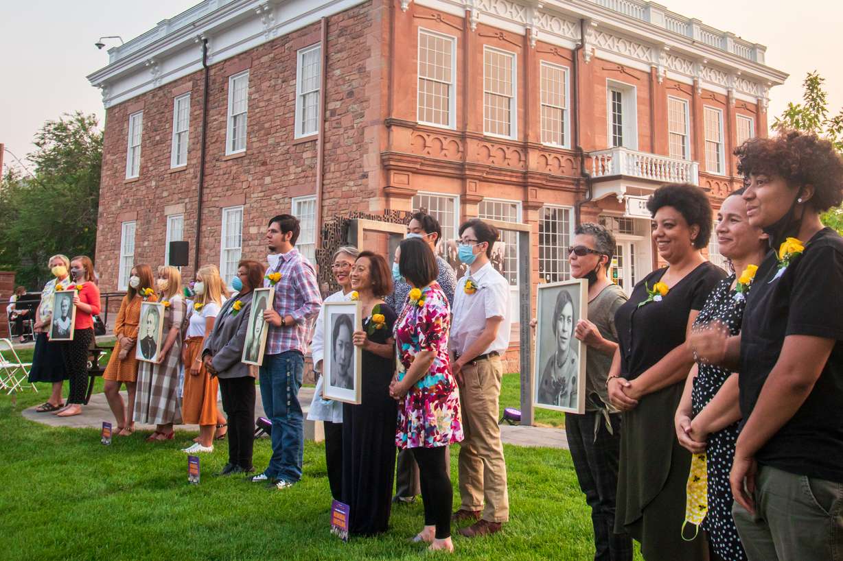 From left to right: Descendants of Emily Richards, Elizabeth Hayward, Violet Allen, Alice Kasai and Mignon Barker Richmond pose for a photo while holding up images of the women during a celebration unveiling the new women's suffrage memorial on Thursday, Aug. 20, 2020. The five women played instrumental roles in ensuring state and federal legislation that made voting equal to women and persons of color from 1895 through 1965.