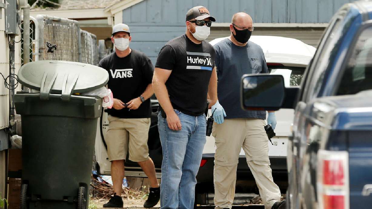 Members of law enforcement work at a home near 1700 Indiana Avenue in Salt Lake City on Friday, May 29, 2020, where a suspect in a fatal shooting near 2900 South and 3000 West in West Valley City was arrested.