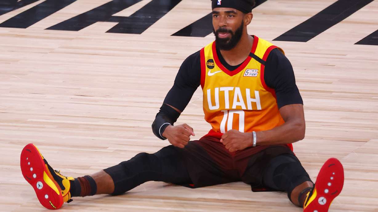 Utah Jazz's Mike Conley reacts after being fouled during the third quarter of Game 3 of an NBA basketball first-round playoff series against the Denver Nuggets, Friday, Aug. 21, 2020, in Lake Buena Vista, Fla.