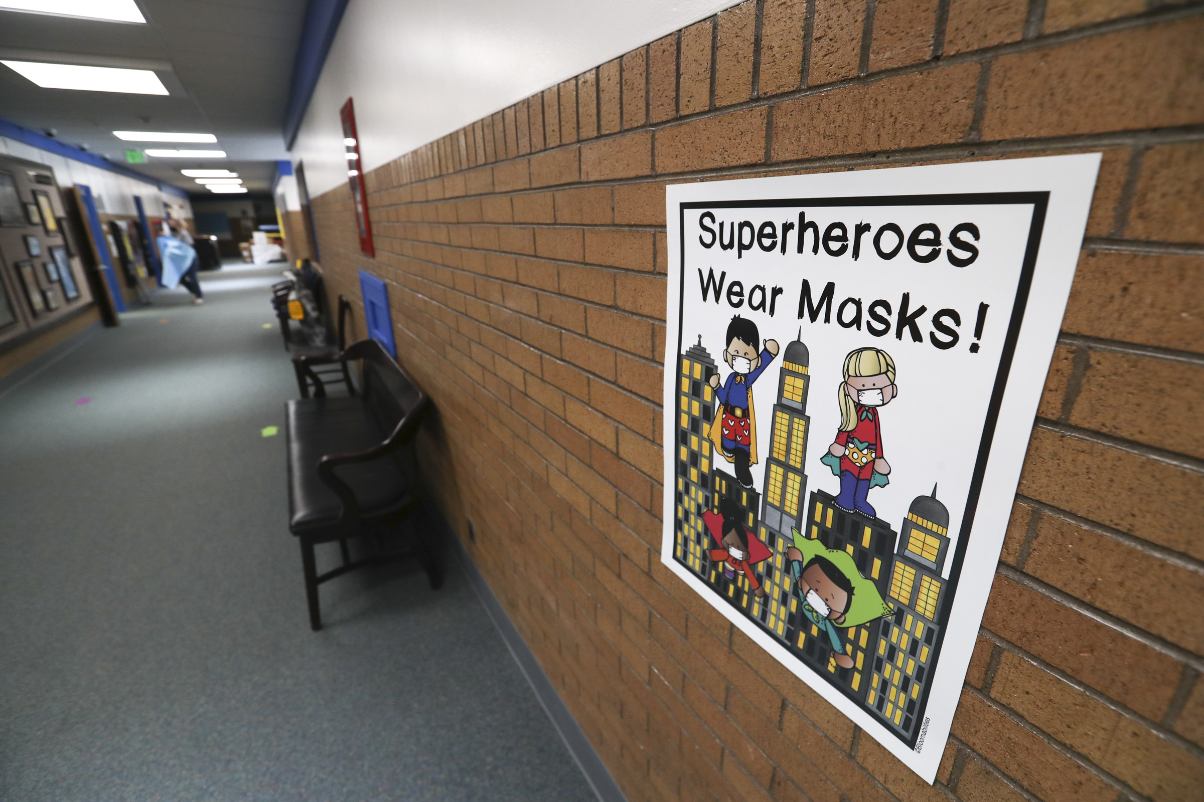 Signs in the hallways remind students to wear face coverings at Westvale Elementary School in West Jordan on Wednesday, Aug. 19, 2020. The Jordan Board of Education will appropriate $500 to each classroom teacher for personal protective equipment and supplies.