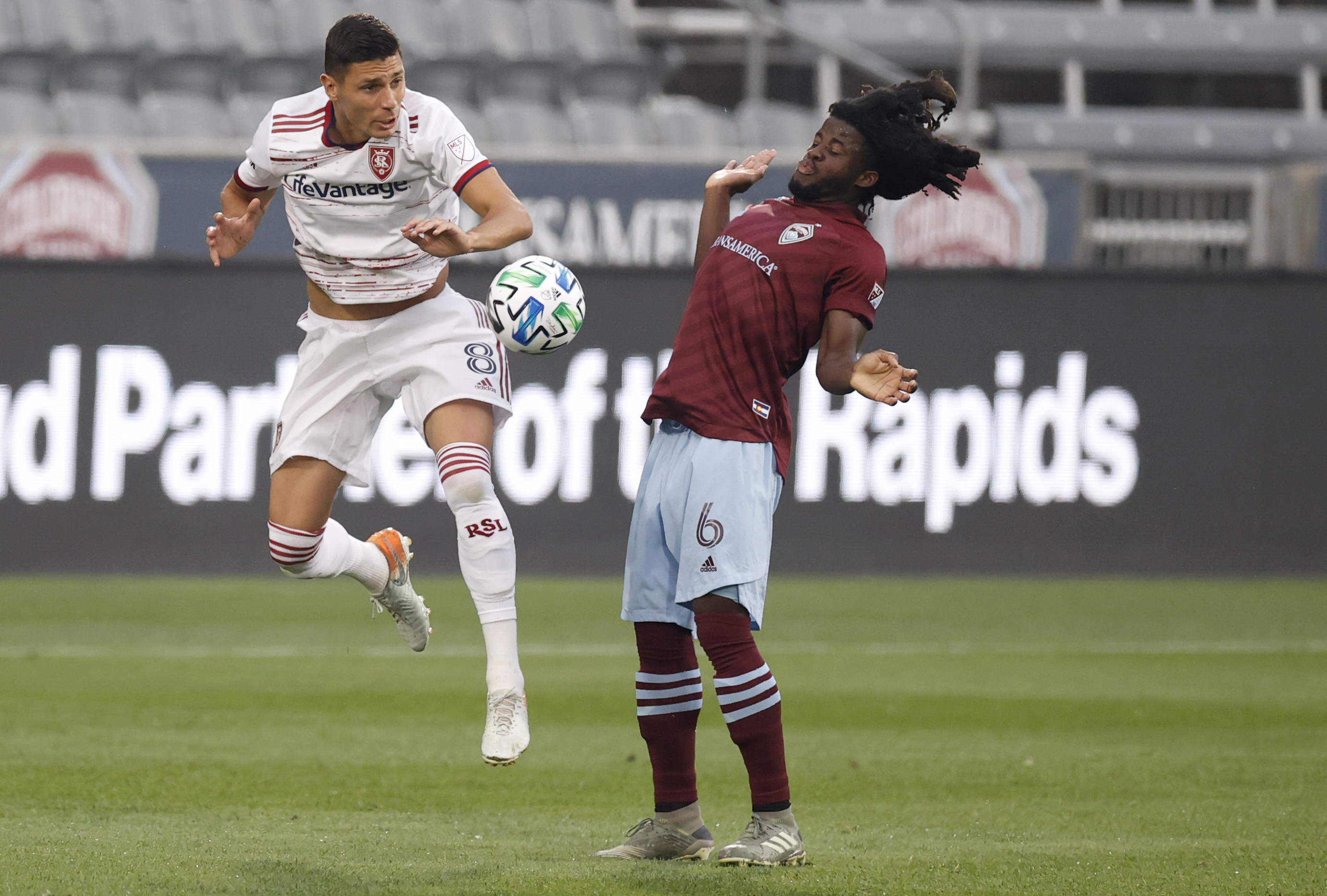 Real Salt Lake midfielder Damir Kreilach, left, vies for control of the hall with Colorado Rapids defender Lalas Abubakar durign the first half of an MLS soccer match Saturday, Aug. 22, 2020, in Commerce City, Colo. (AP Photo/David Zalubowski)