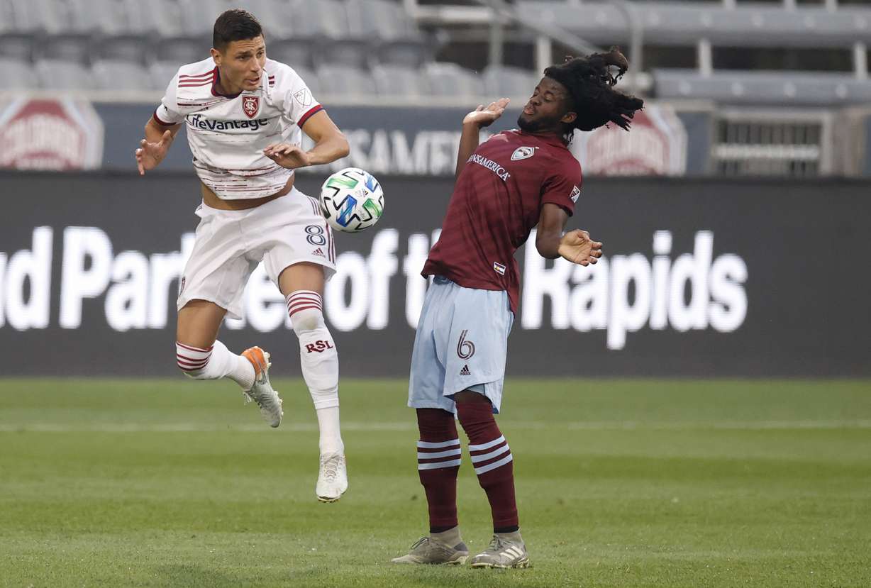 Real Salt Lake midfielder Damir Kreilach, left, vies for control of the hall with Colorado Rapids defender Lalas Abubakar durign the first half of an MLS soccer match Saturday, Aug. 22, 2020, in Commerce City, Colo. (AP Photo/David Zalubowski)