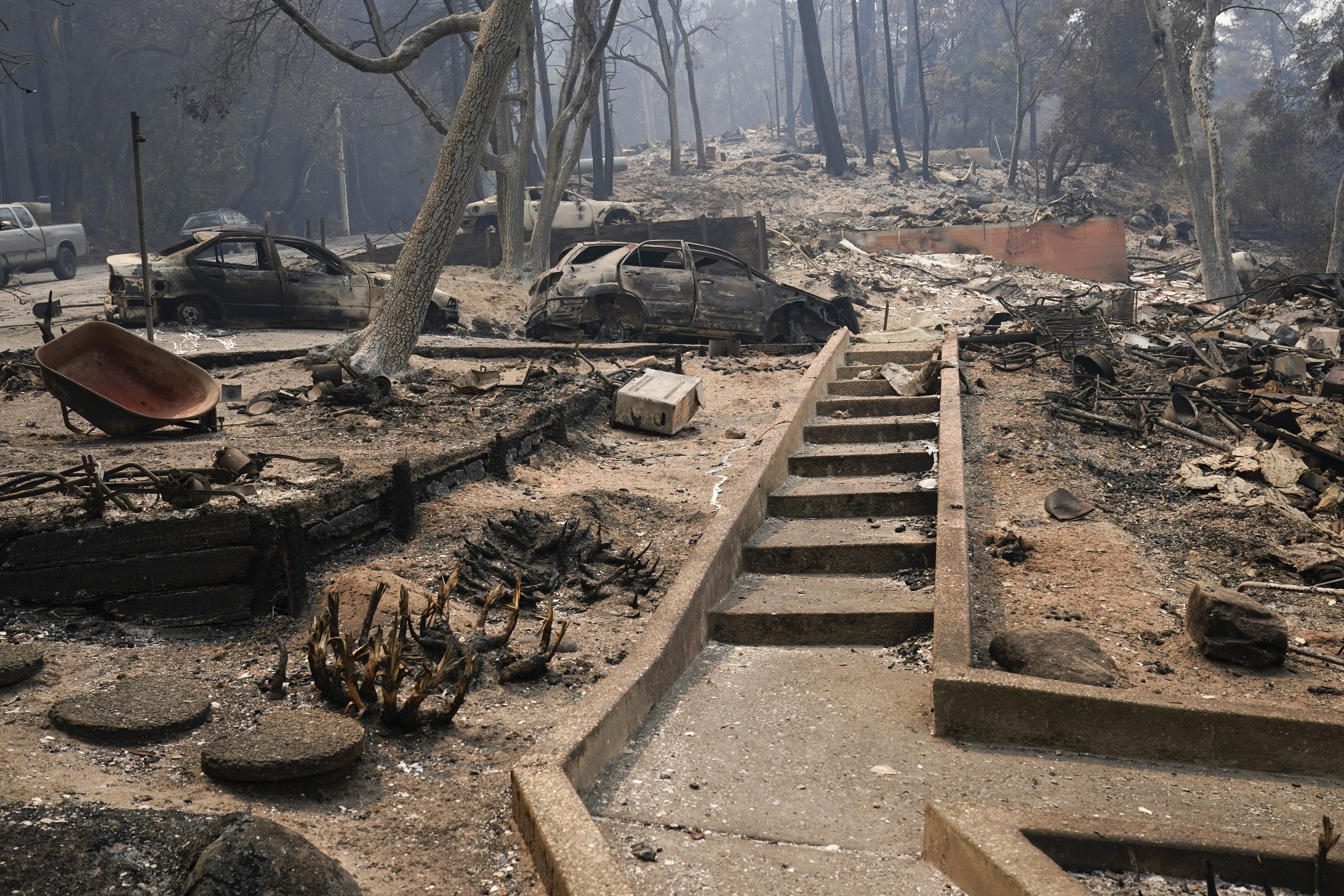 Vehicles and homes have been burned after the CZU Lightning Complex Fire went through Sunday, Aug. 23, 2020, in Boulder Creek, Calif.