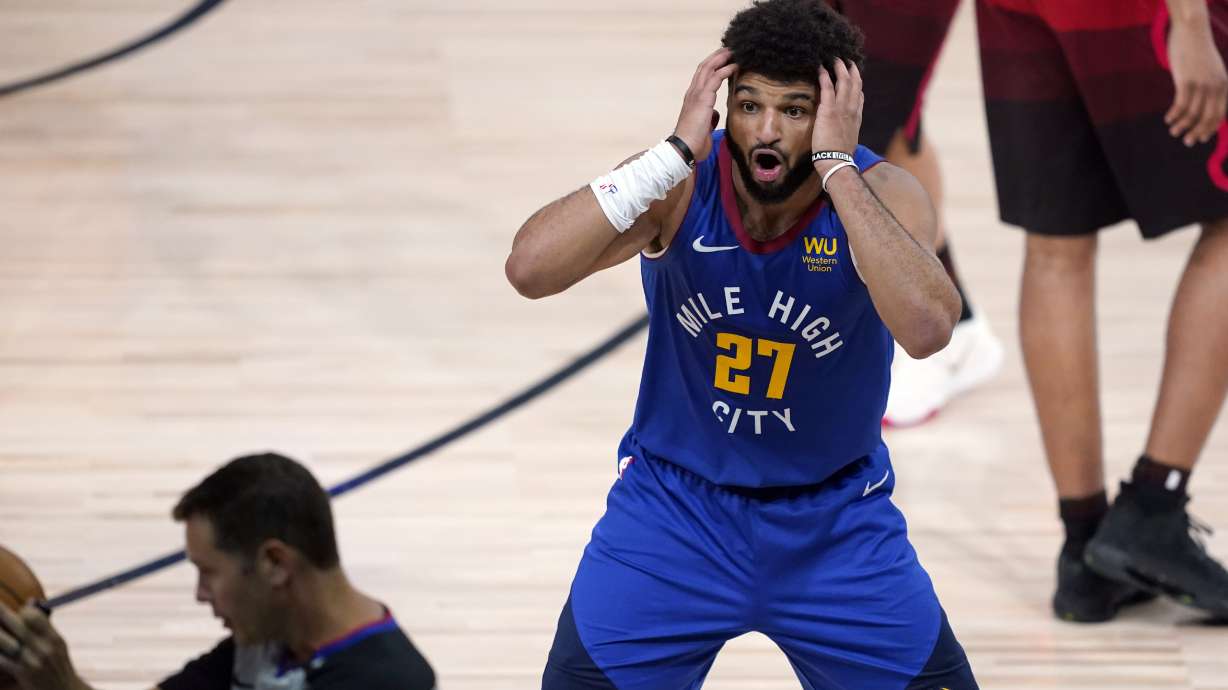 Denver Nuggets' Jamal Murray (27) reacts to a call during the first half of an NBA basketball first round playoff game against the Utah Jazz Sunday, Aug. 23, 2020, in Lake Buena Vista, Fla.
