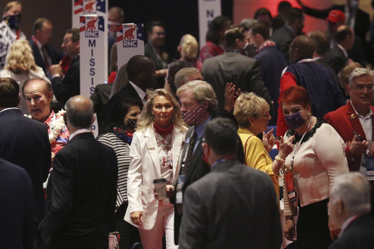 The crowd mingles at the conclusion of President Donald Trump's speech during the first day of the Republican National Convention Monday, Aug. 24, 2020, in Charlotte, N.C.