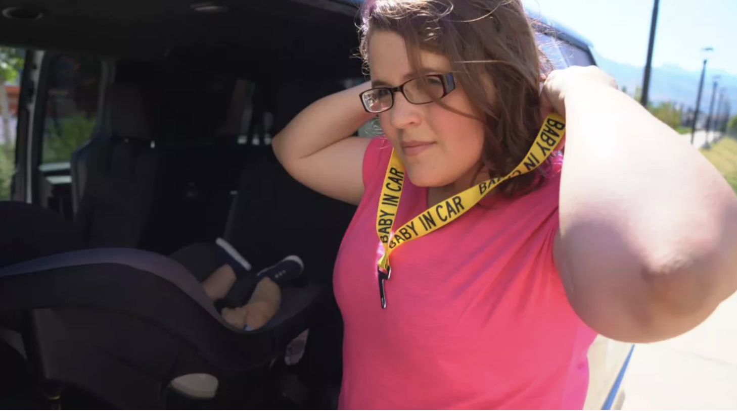 Felicia Ellis, of Ogden, is pictured wearing a “Baby in Car” lanyard next to a child buckled into a car seat during a 2018 demonstration at Primary Children’s Hospital. The hospital celebrated 30 years of its Hold On To Dear Life campaign, which advocates for children car safety, on Tuesday.