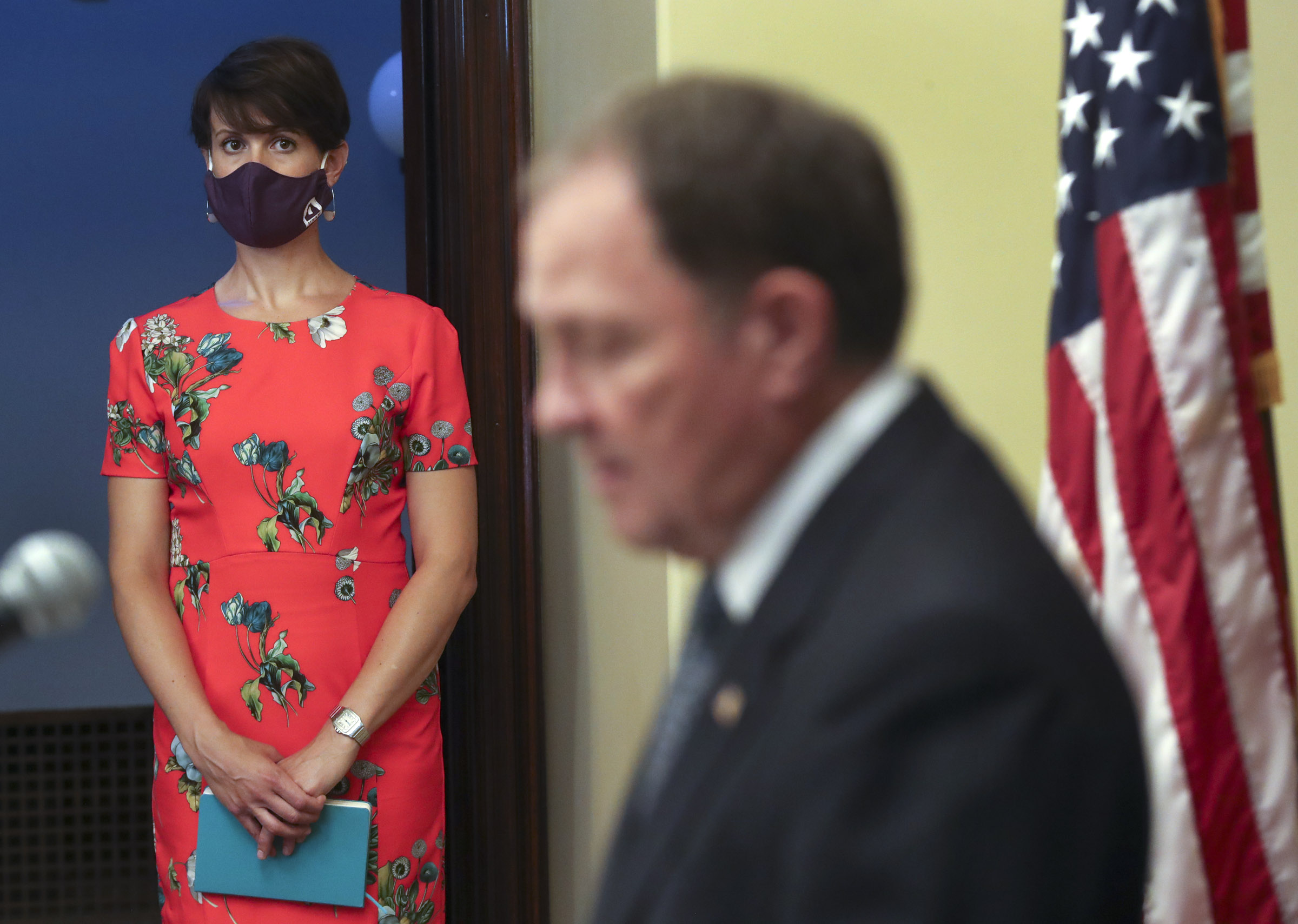 Dr. Angela Dunn, state epidemiologist with the Utah Department of Health, listens to Gov. Gary Herbert during a COVID-19 briefing at the Capitol in Salt Lake City on Wednesday, Aug. 26, 2020.