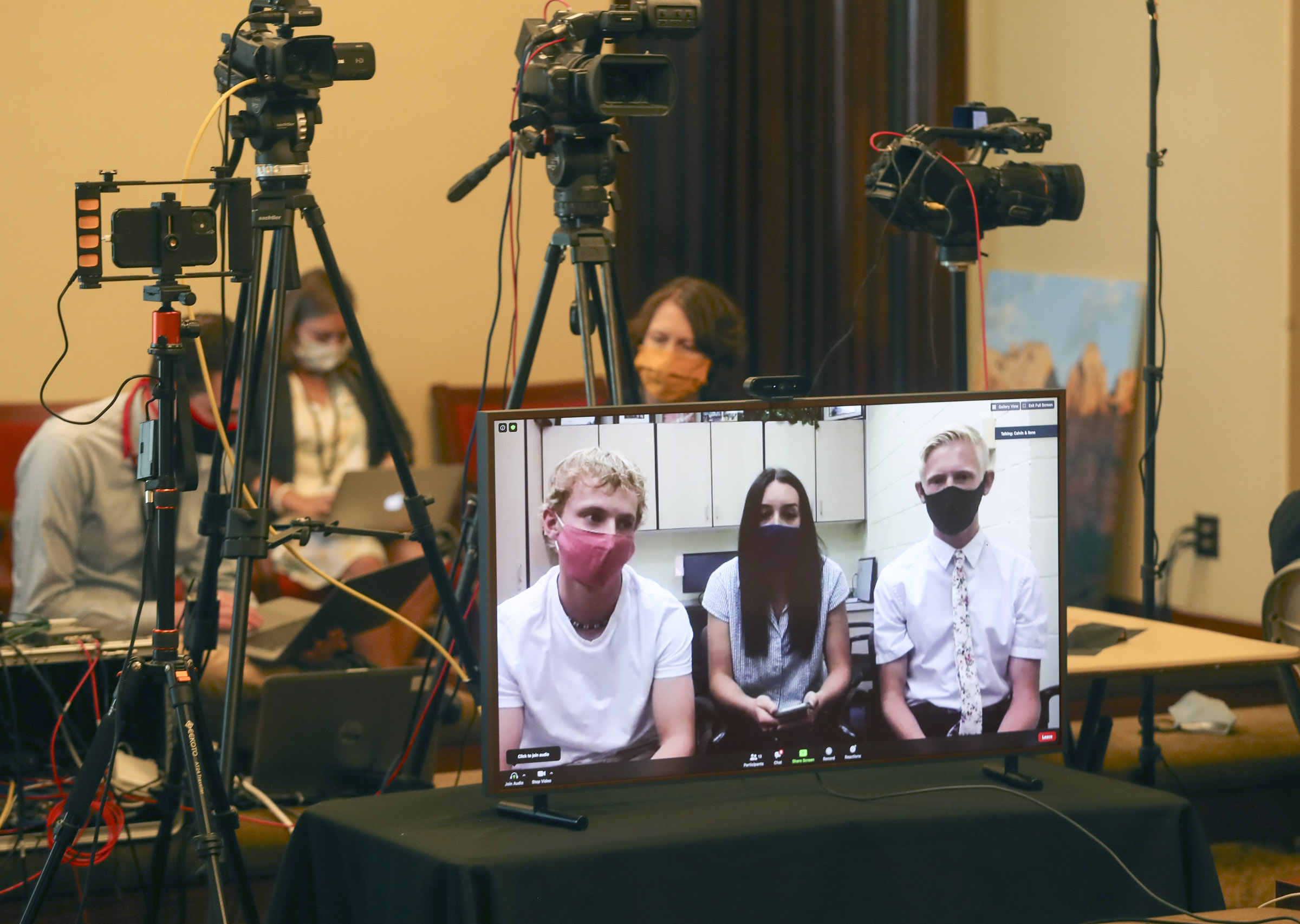 Broc Gardner, left, Dallee Cobb and Dawson Thelin, seniors at Enterprise High School Enterprise in Washington County, participate virtually in a COVID-19 briefing at the Capitol in Salt Lake City on Wednesday, Aug. 26, 2020. The students spoke about their first week back in school.