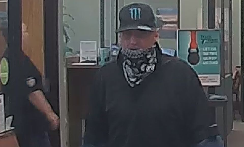 Security footage of an alleged robber at a bank in Sandy on Aug. 21, 2020.
