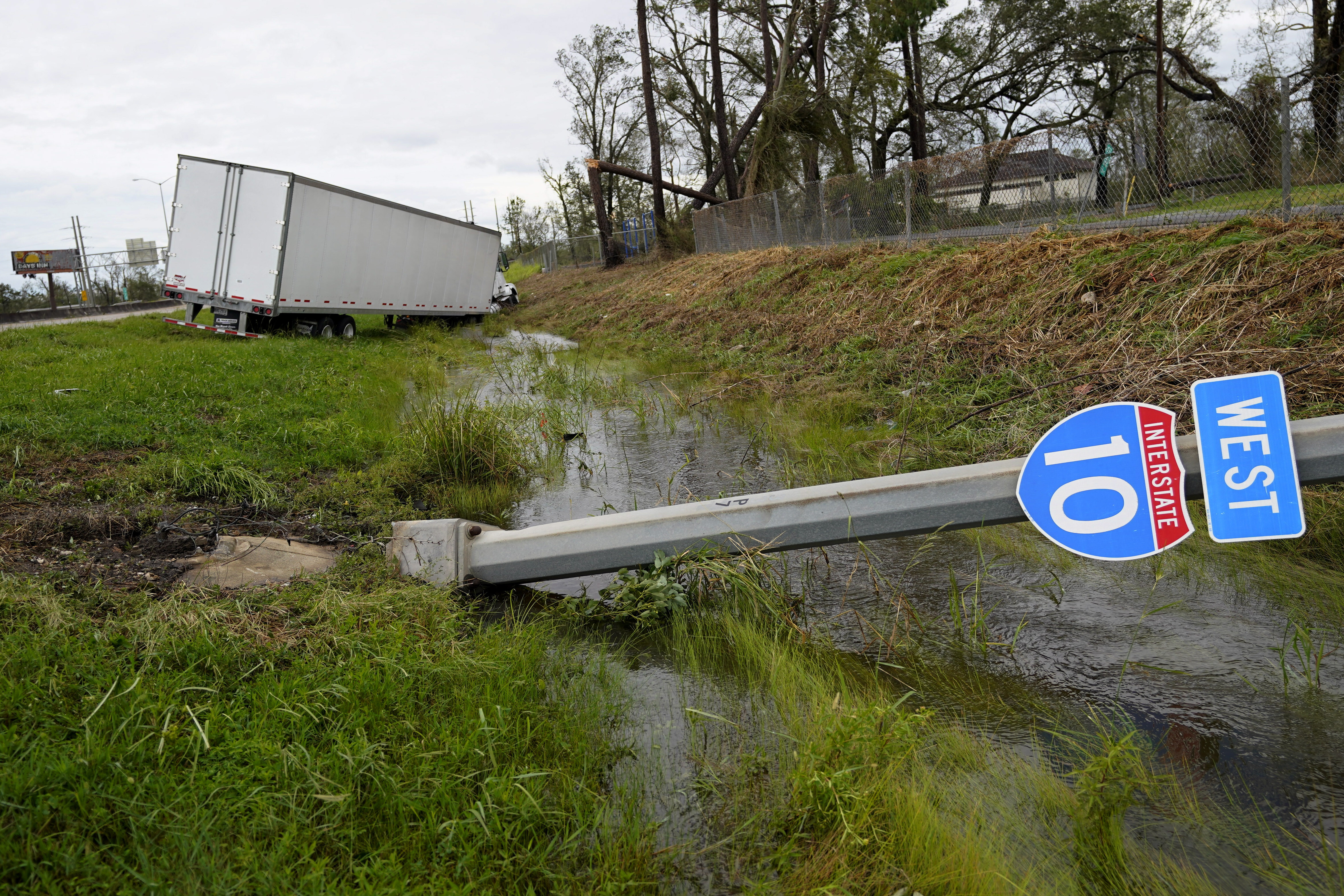 A truck and Interstate 10 sign is seen on Thursday, Aug. 27, 2020, in Lake Charles, La., after Hurricane Laura moved through the state. (AP Photo/Gerald Herbert) [Aug-27-2020]