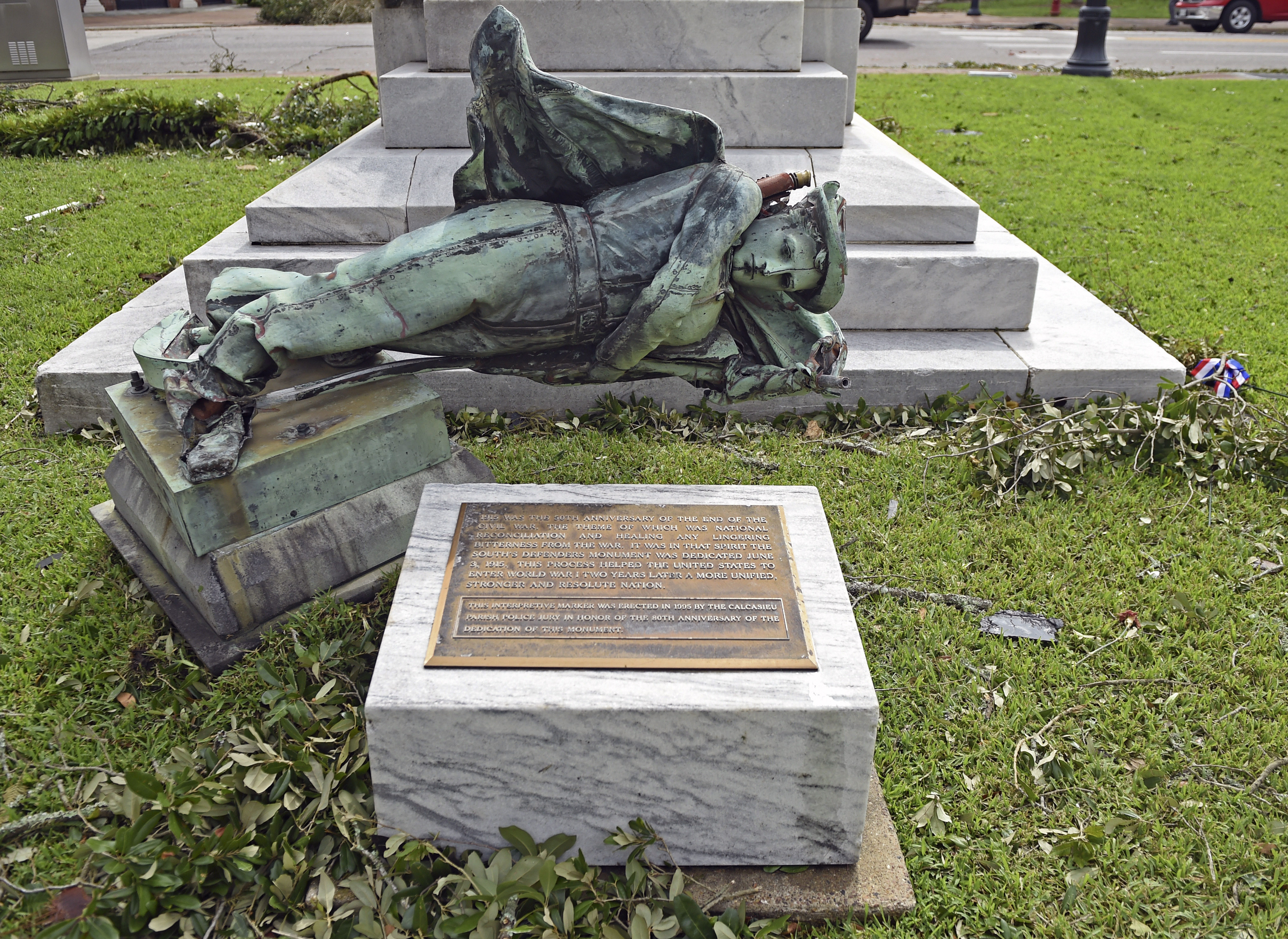 A confederate statue sits toppled in front of the Calcasieu Parish Courthouse on Ryan Street after Hurricane Laura made landfall as a Category 4 storm Thursday, Aug. 27, 2020 in Lake Charles, La. (Hilary Scheinuk/The Advocate via AP) [Aug-27-2020]