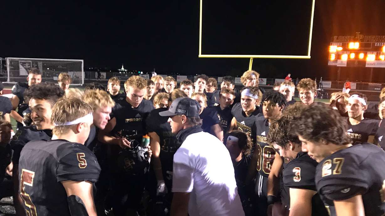 Lone Peak coach Bart Brockbank speaks with his team after a 32-8 win over East to improve to 3-0, Friday, Aug. 28, 2020.