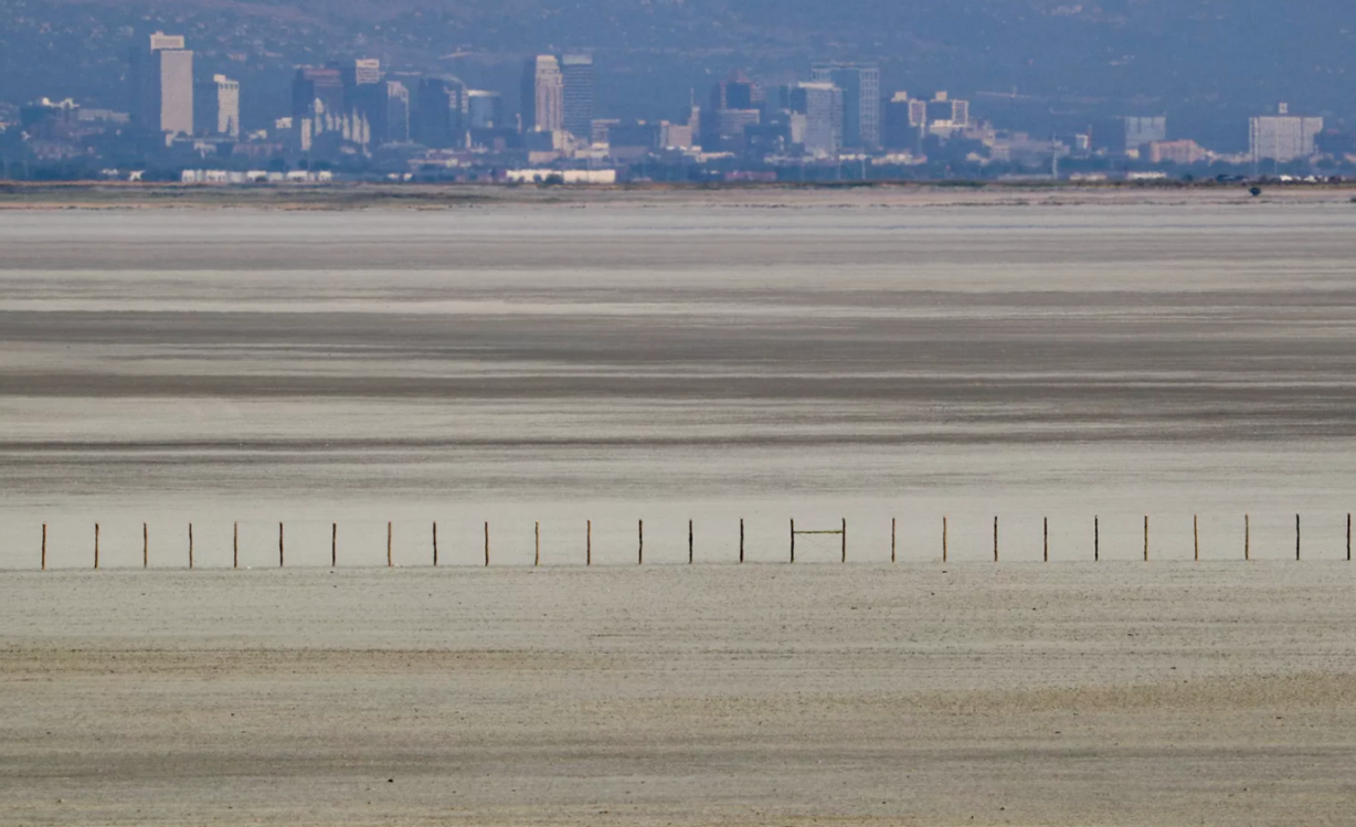 The Salt Lake City skyline rises above a receding Great Salt Lake, seen from Antelope Island on Aug. 25, 2020.