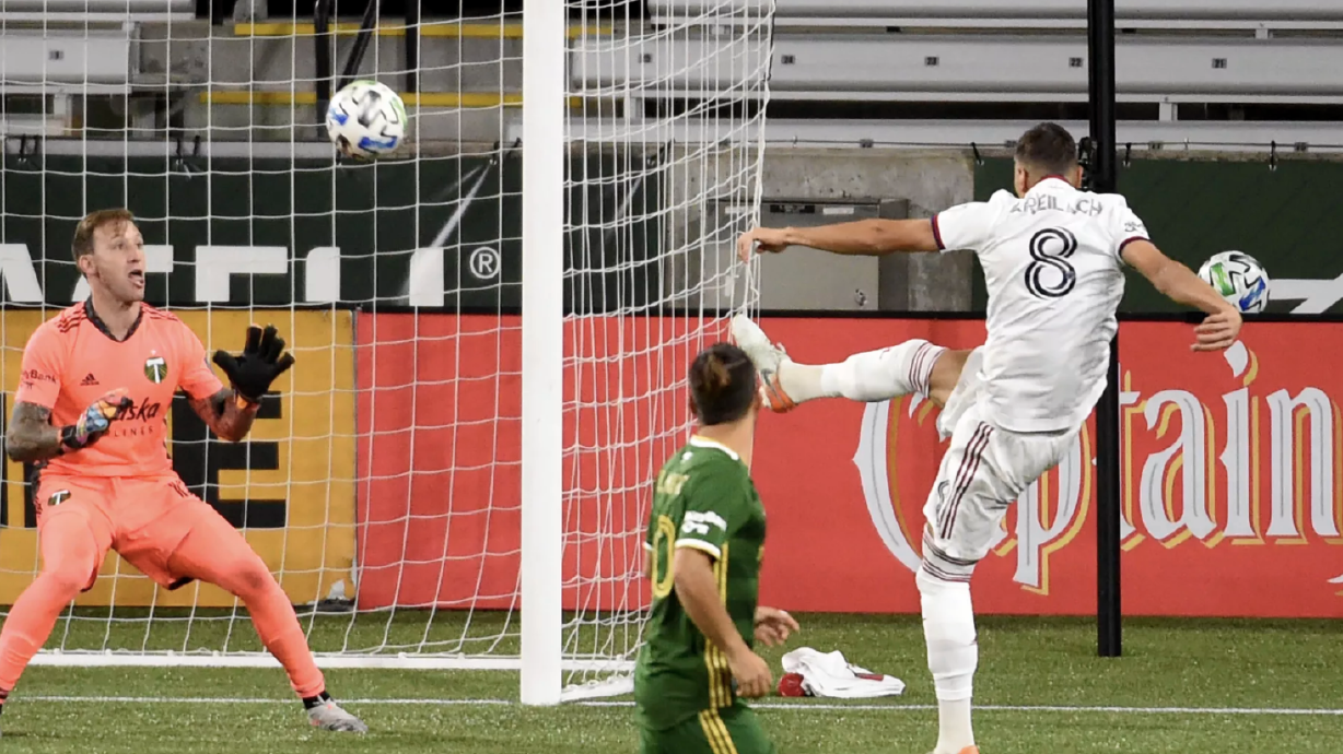 Real Salt Lake midfielder Damir Kreilach, right, score a goal past Portland Timbers goalkeeper Steve Clark, left, during the second half of an MLS soccer match in Portland, Ore., Saturday, Aug. 29, 2020. The match ended in a 4-4 draw.