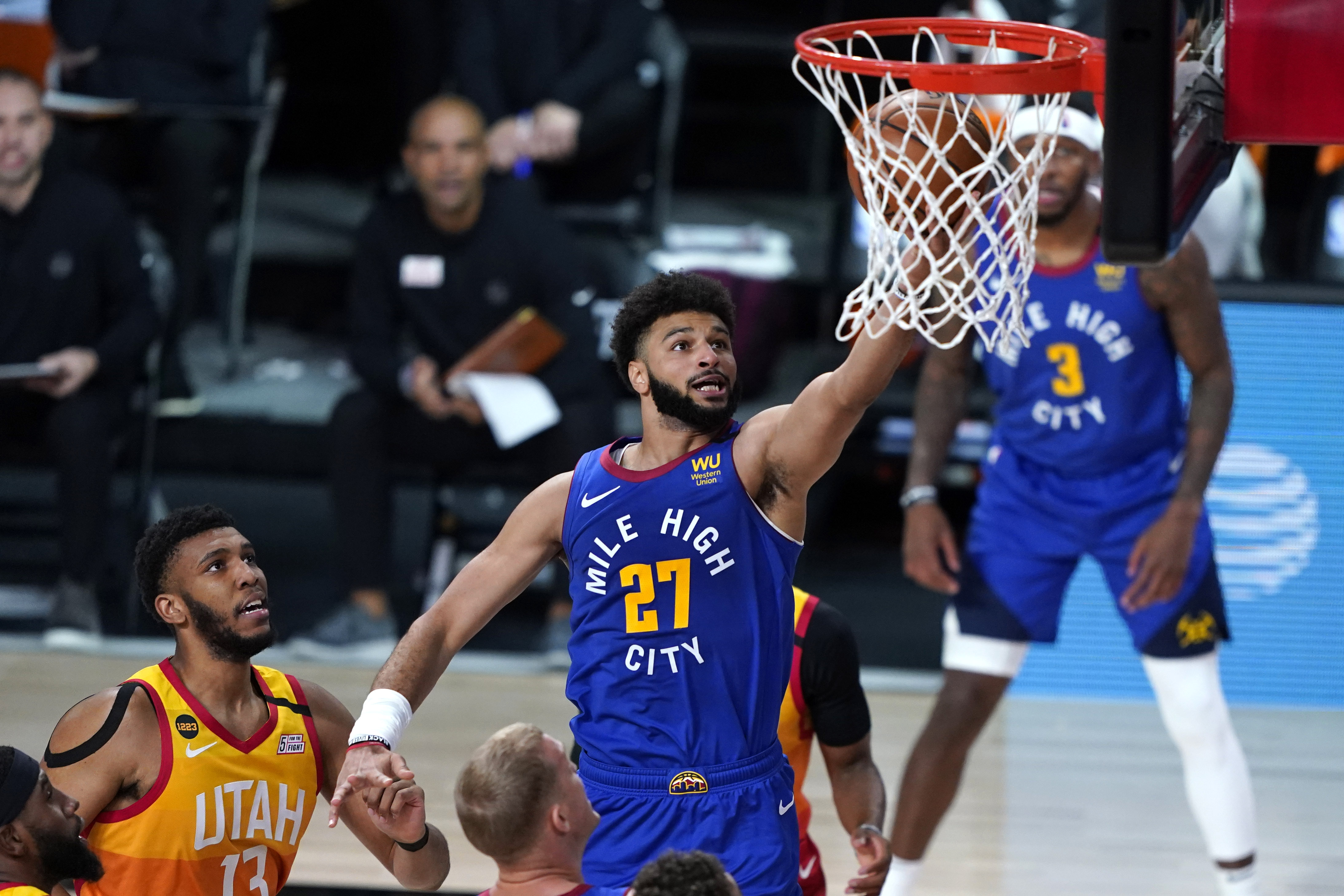 Denver Nuggets' Jamal Murray (27) goes up for a shot against the Utah Jazz during the first half of an NBA basketball first round playoff game Sunday, Aug. 30, 2020, in Lake Buena Vista, Fla.