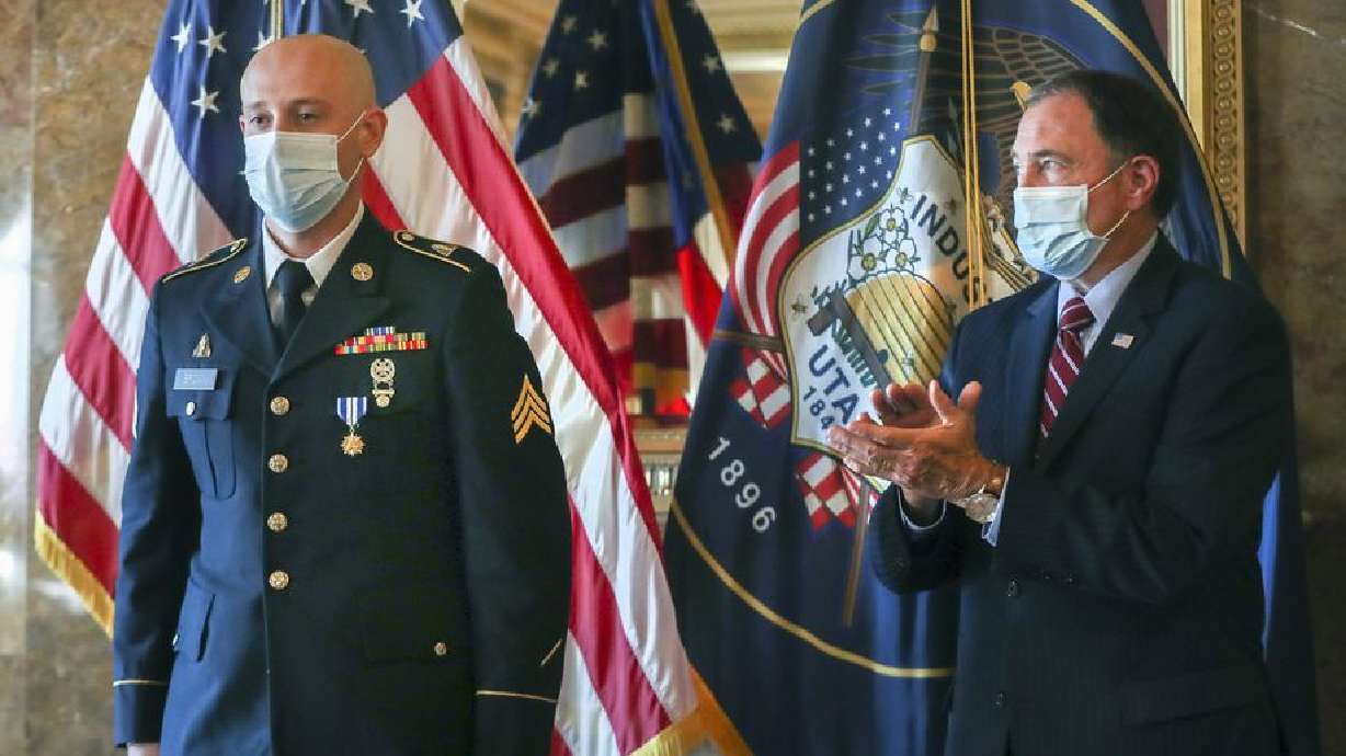 Gov. Gary Herbert applauds for Sgt. Chasen Brown, a service member of the Utah National Guard, after presenting him with the Utah Medal of Valor in the Gold Room at the Utah State Capitol on Tuesday, Sept. 1, 2020. Brown, a gunner for Charlie Battery, 2nd Battalion, 222nd Field Artillery, was attending the Route 91 Harvest music festival in Las Vegas on Oct. 1, 2017. Shortly after the concert started, a man began shooting at the massive crowd. Without hesitation or regard to personal safety, Brown immediately rendered aide to the wounded while under constant gunfire. His actions on that day, also known as one of the deadliest mass shootings in the United States, saved the lives of dozens of fellow concertgoers.