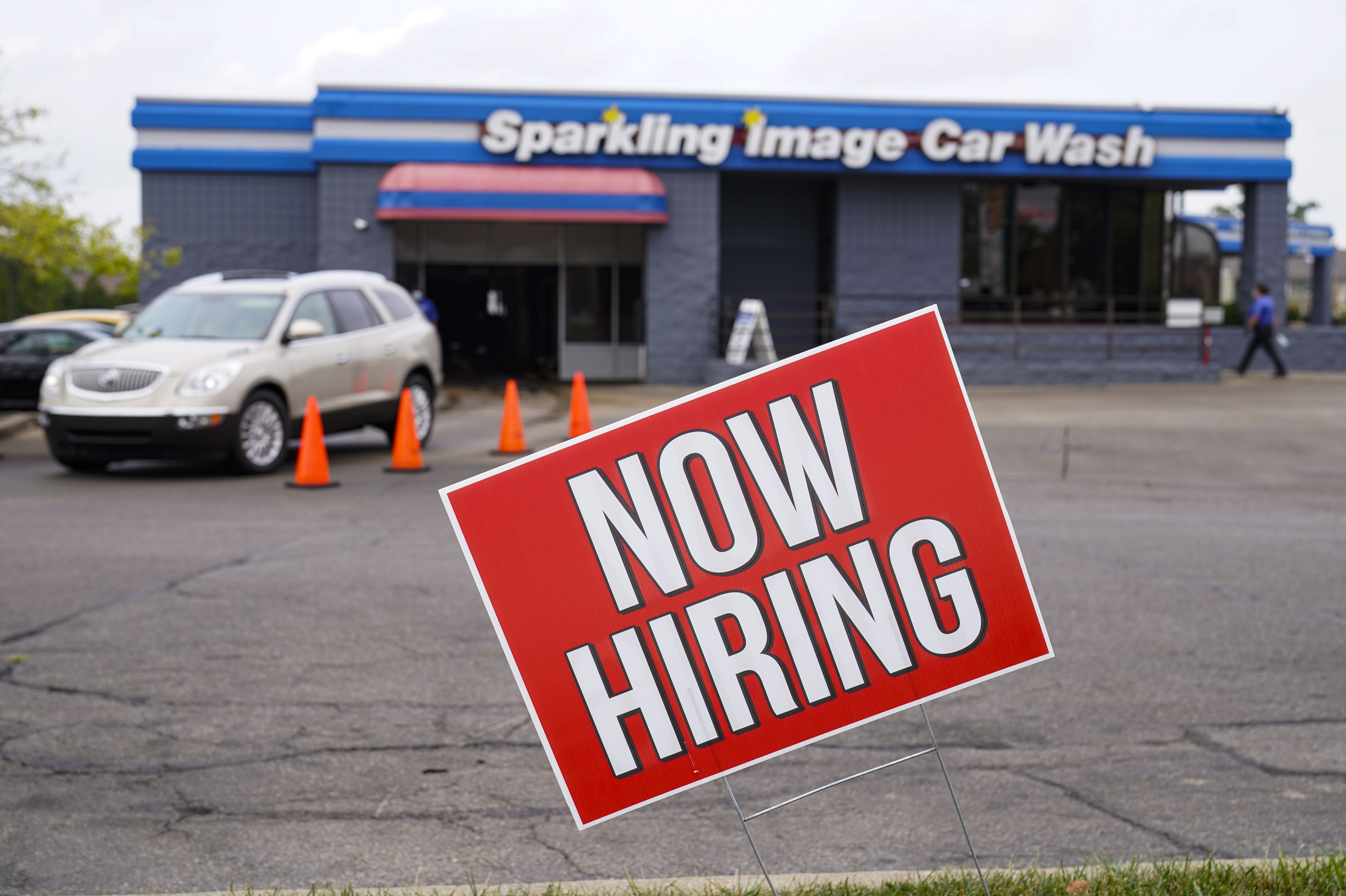 FILE - In this Sept. 2, 2020, file photo, a help wanted sign is displayed at car wash in Indianapolis. The Labor Department reported unemployment numbers Thursday, Sept. 3. (AP Photo/Michael Conroy, File) [Sep-03-2020]