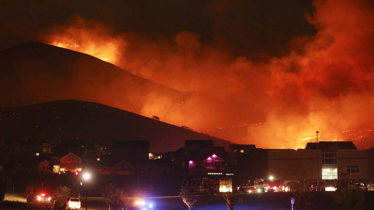A wildfire on Traverse Mountain threatens homes in Lehi on Sunday, June 28, 2020.