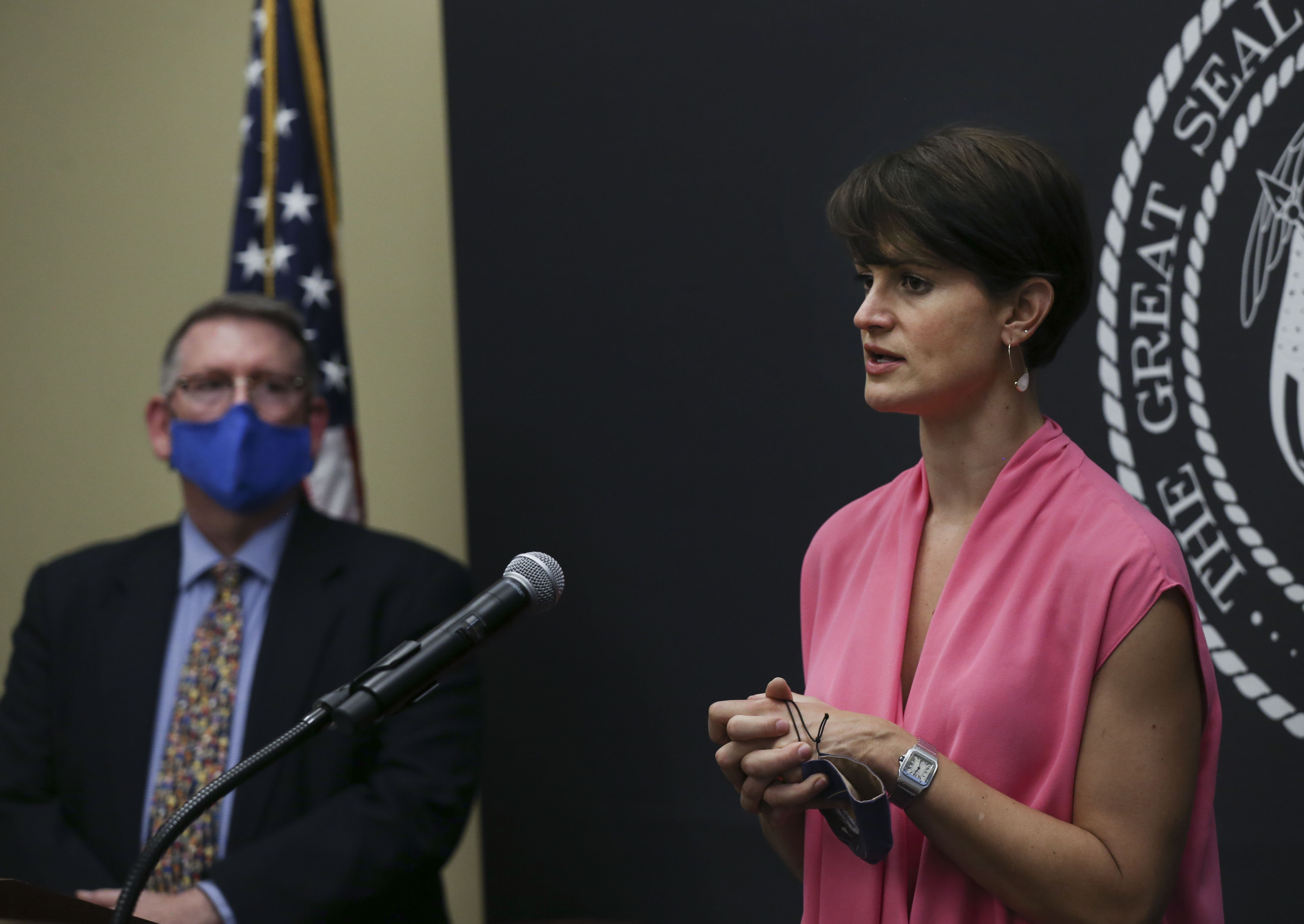 Erik Christensen, chief medical examiner for the Utah Department of Health, left, listens as Angela Dunn, state epidemiologist with the Utah Department of Health, speaks at the COVID-19 briefing at the Capitol in Salt Lake City on Thursday, Sept. 3, 2020.