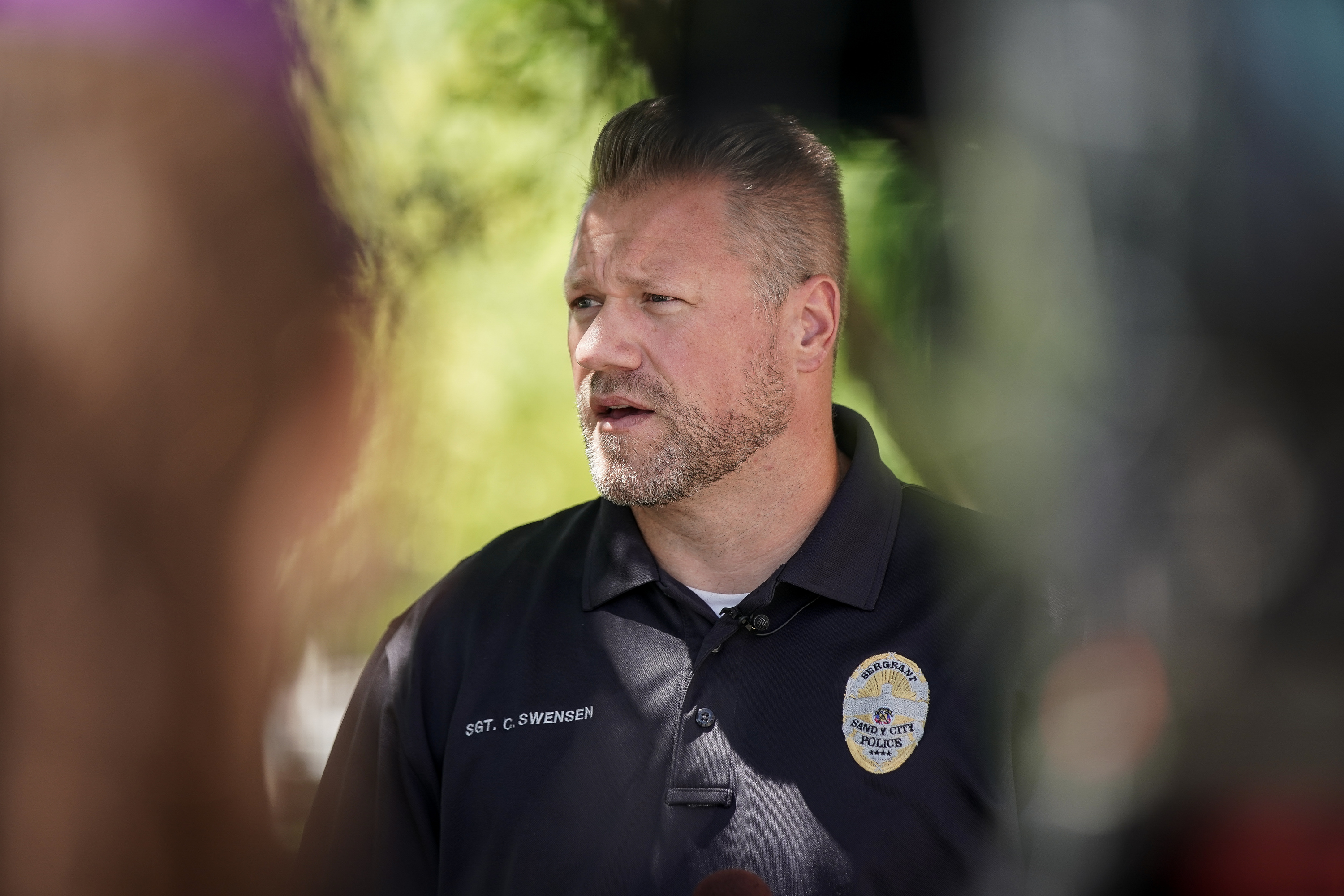 Sandy Police Sgt. Clayton Swensen talks to the media outside the Sandy police department in on Thursday, July 23, 2020.