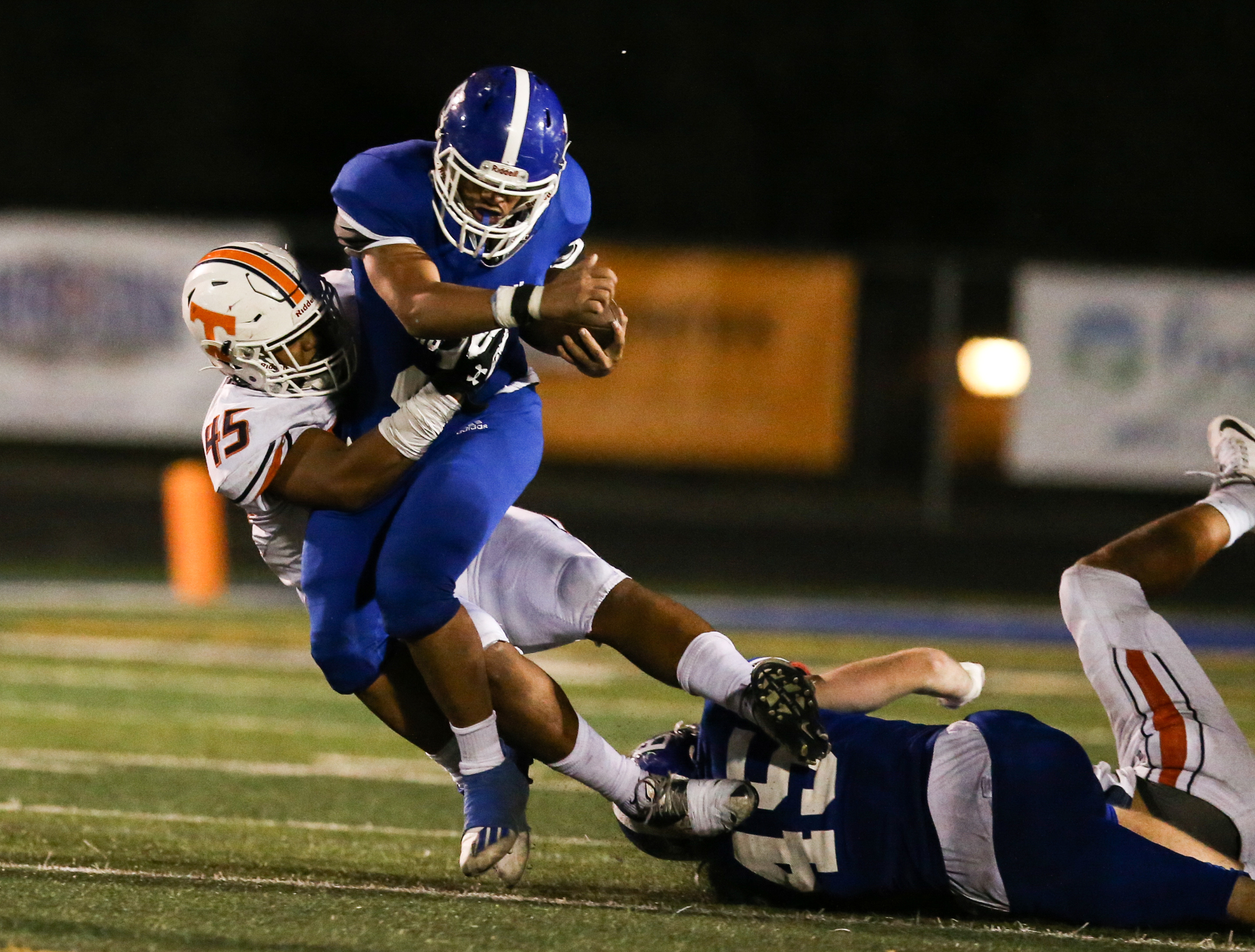 Bingham's Saia Lomu (2) carries the ball against Timpview's Taylor Malo (45) during a high school football game at Bingham High School in South Jordan on Thursday, Sept. 3, 2020.