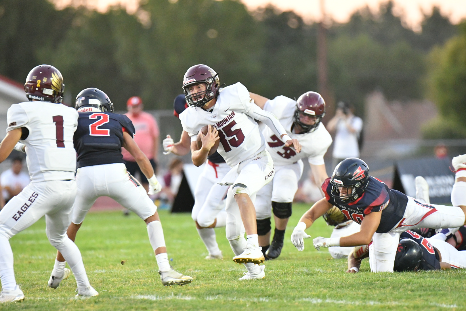 Maple Mountain quarterback Tyler Nelson scrambles for yardage against Springville while wearing the jersey of his close friend Bryson McQuivey, who has cancer. Maple Mountain won, 29-15, Friday, Sept. 4, 2020.