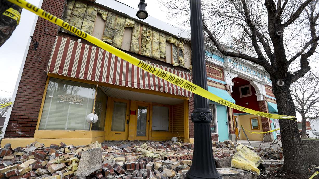 Caution tape surrounds a damaged building on Magna's Main Street on March 24, 2020, following a 5.7 magnitude earthquake on March 18, 2020. A 2.5 magnitude aftershock in Magna on Friday was reported by over 250 people, according to seismologists.
