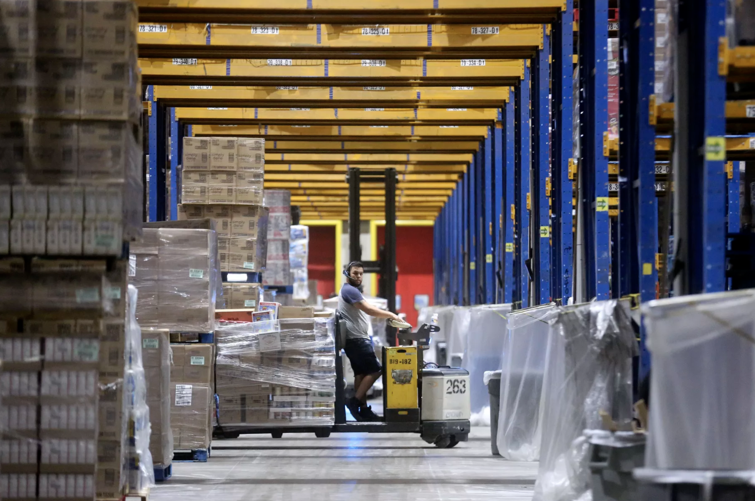 An Associated Foods employee works at the Associated Foods distribution warehouse in Farr West, Weber County, on Wednesday, Aug. 19, 2020. 