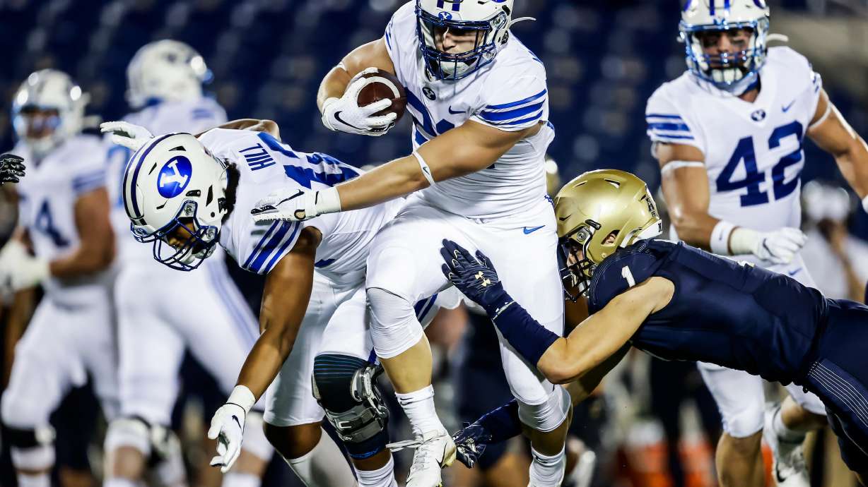 BYU running back Jackson McChesney runs for a 9-yard touchdown during the second half of the Cougars' NCAA college football game at Navy, Monday, Sept. 7, 2020 in Annapolis, Maryland.