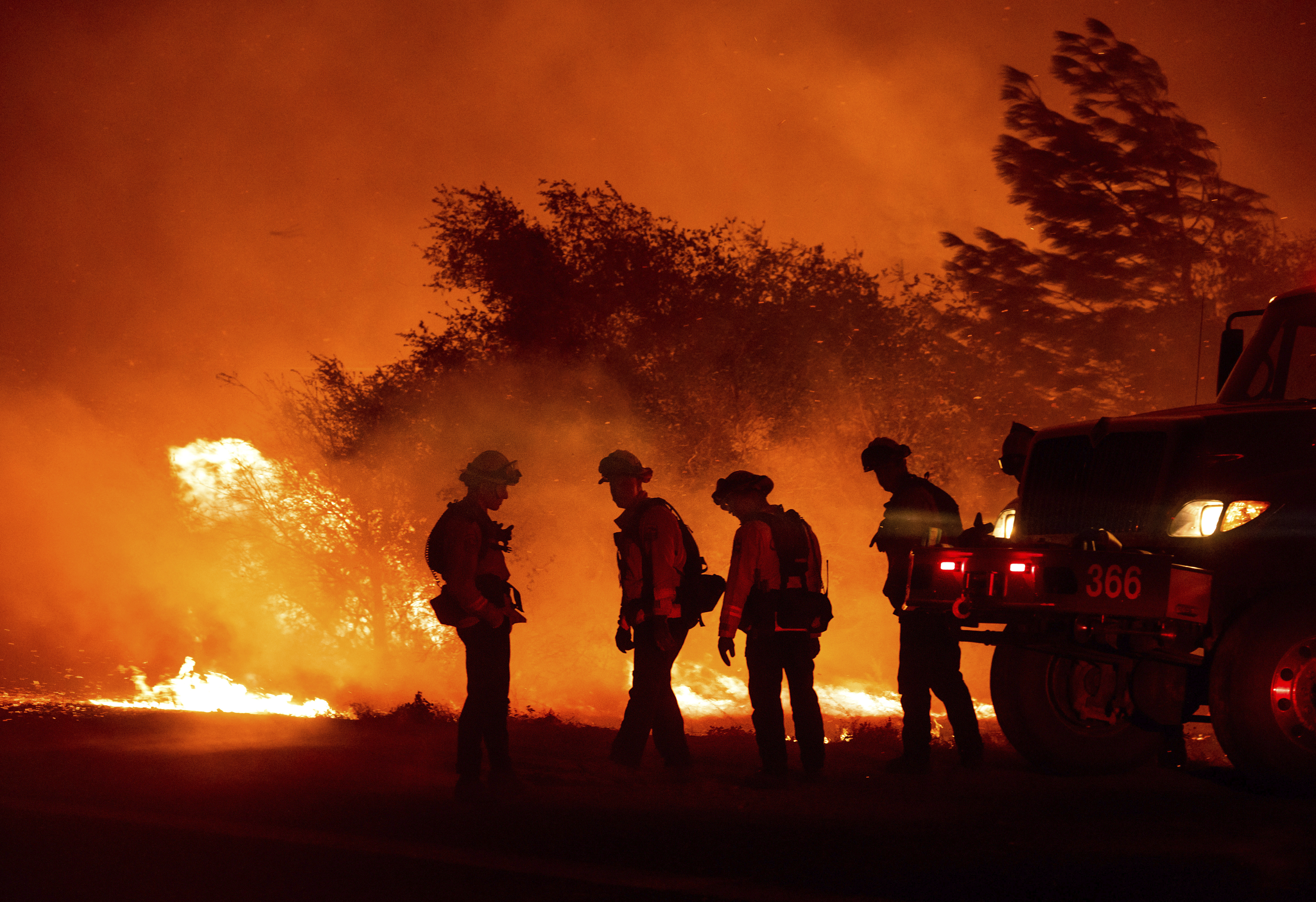 Firefighters monitor the Bear Fire burning in Oroville, Calif., on Wednesday, Sept. 9, 2020. The blaze, part of the lightning-sparked North Complex, expanded at a critical rate of spread as winds buffeted the region. (AP Photo/Noah Berger) [Sep-09-2020]