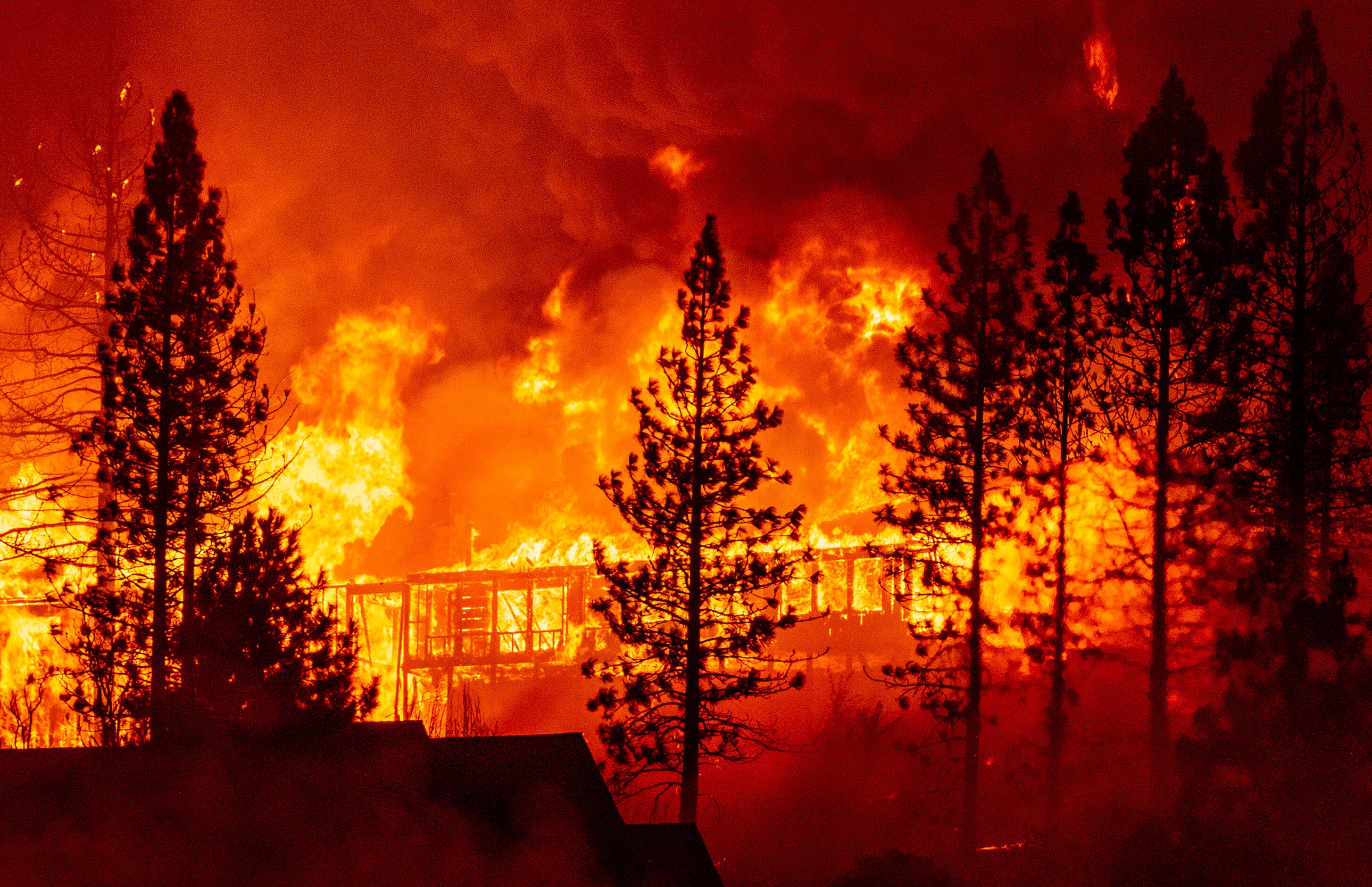 A home is engulfed in flames during the "Creek Fire" in the Tollhouse area of unincorporated Fresno County, California early on Sept. 8, 2020.