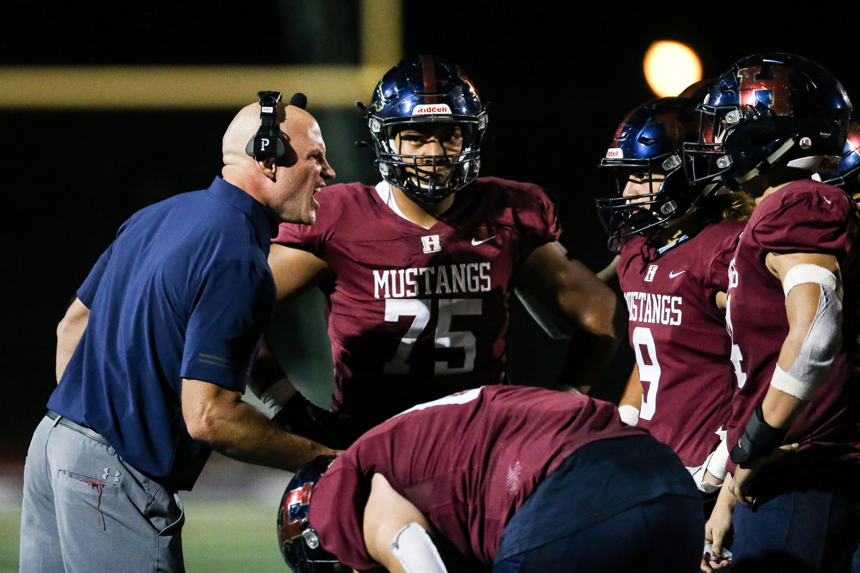 Herriman head coach Dustin Pearce yells at his players during a high school football game at Herriman High School in Herriman on Friday, Sept. 4, 2020.