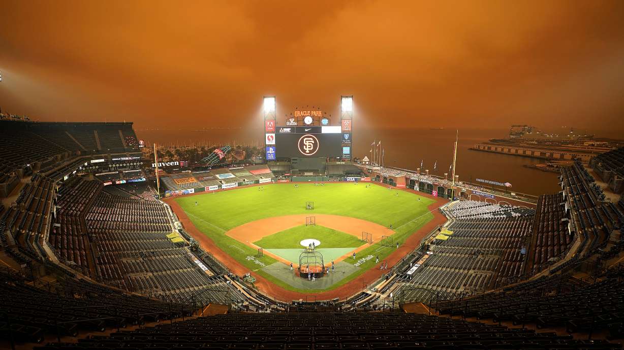 Smoke from nearby wildfires creates eerie baseball scene