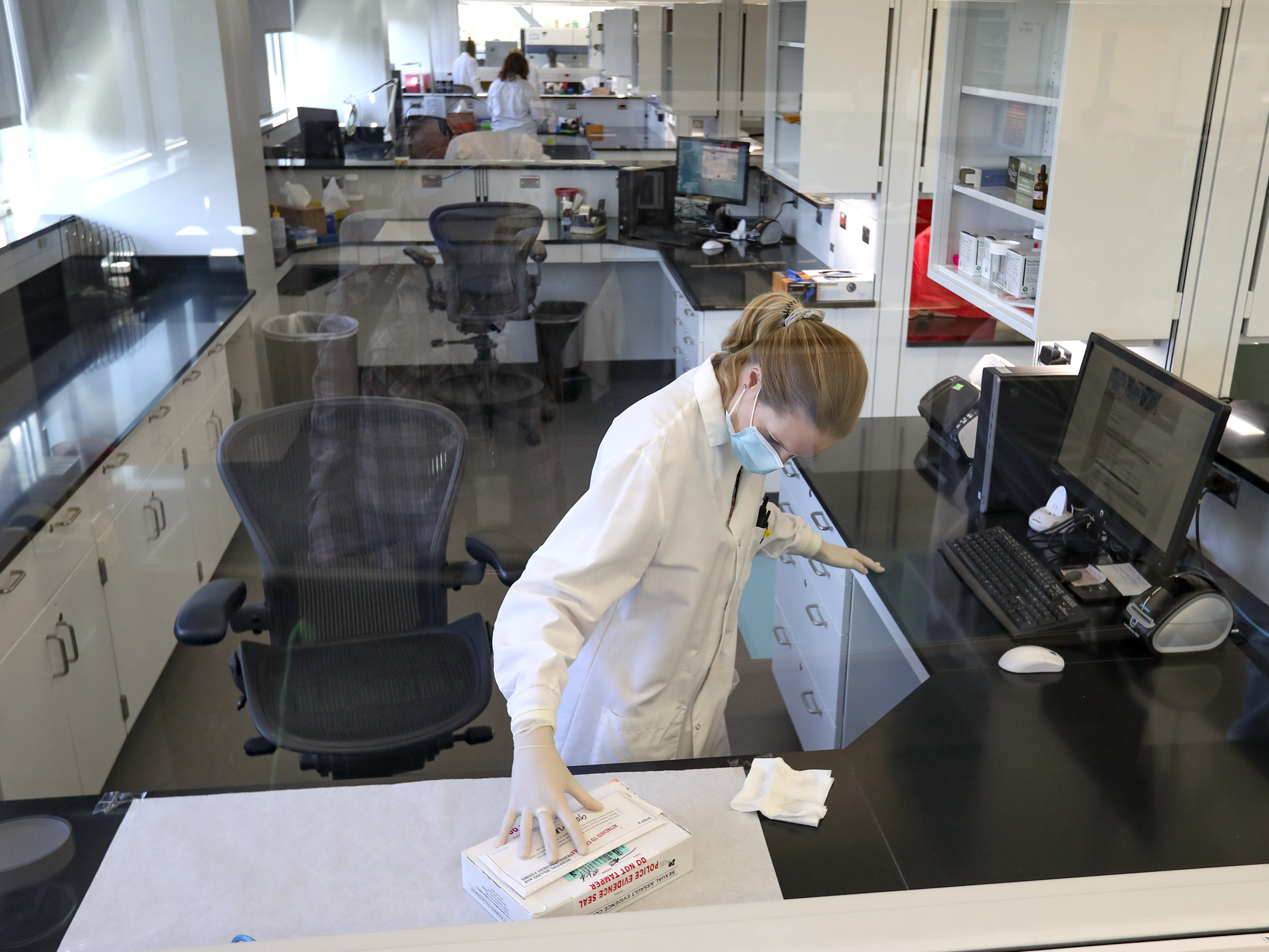Meghan Curran, a forensic scientist for the Utah State Crime Lab, processes a sexual assault kit in the labâs offices in West Valley City on Thursday, Sept. 10, 2020. State officials announced Utah has worked its way through a backlog of more than 3,000 sexual assault kits, becoming the eighth state in the nation to do so.