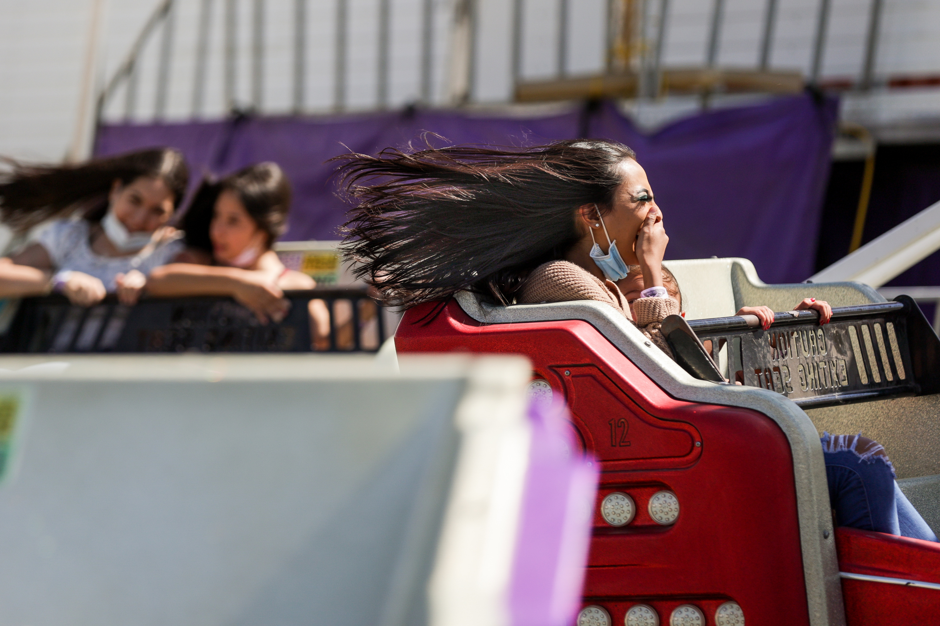 Berta Murillo’s hair goes flying as she takes a ride with her sister, Kendra, 5, at the Utah State Fair at the fairpark in Salt Lake City on Friday, Sept. 11, 2020.