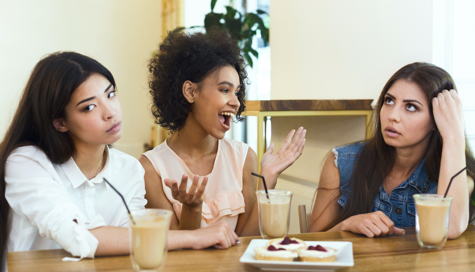 Annoying talkative friend sitting in cafe with girls and storytelling, her friends boring, panorama, empty space, concept