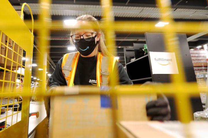Raelee Whipple, process assistant at the newly opened Amazon fulfillment center in South Jordan, works to move packages through the system on Sept. 14, 2020.