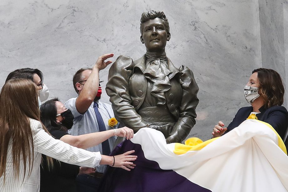 A statue of Dr. Martha Hughes Cannon is unveiled by members of the Statue Oversight Committee during a ceremony at the Capitol in Salt Lake City on Monday, Sept. 14, 2020. The statue will temporarily be on display in the Capitol until COVID-19 restrictions allow for a ceremony in Washington, D.C.