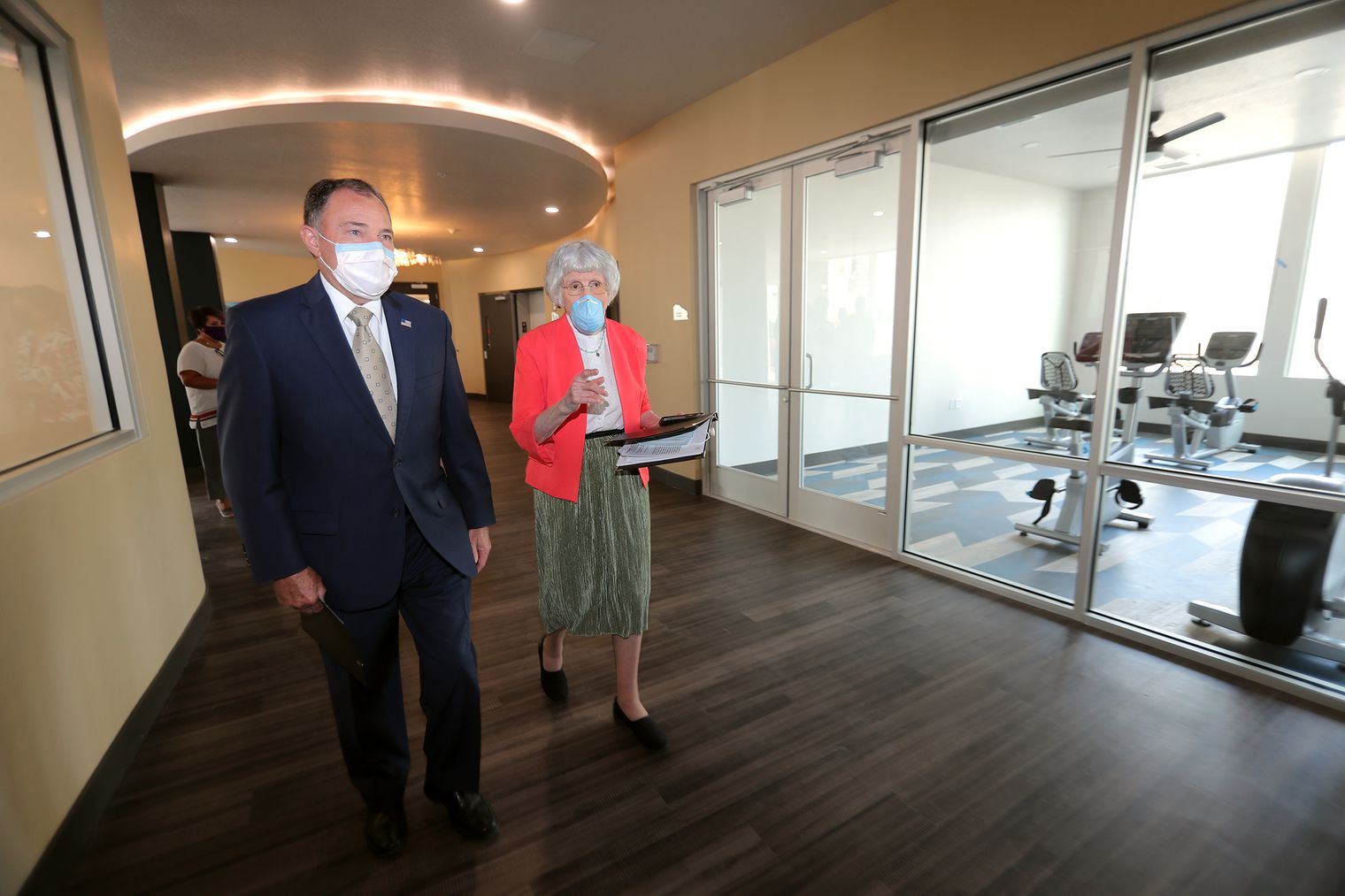 Gov. Gary Herbert, left, and Pamela Atkinson visit during a ribbon-cutting ceremony for Pamela’s Place Apartments in Salt Lake City on Tuesday, Sept. 15, 2020. The Housing Authority of Salt Lake City newest, permanent supportive housing development is named after Atkinson, a longtime community advocate for people experiencing homelessness.
