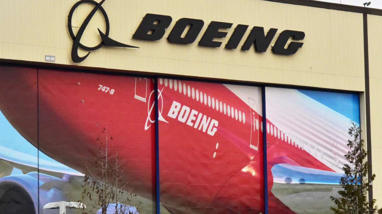 FILE PHOTO: Boeing Co's logo is seen above the front doors of its largest jetliner factory in Everett, Washington, U.S. January 13, 2017. REUTERS/Alwyn Scott