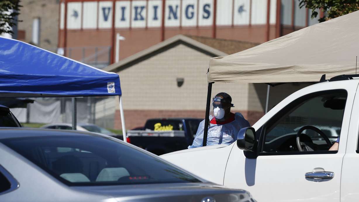 People wait in their vehicles for a COVID-19 test at Pleasant Grove Recreation Center on Wednesday, Sept. 2, 2020. On Thursday, Pleasant Grove High School will pivot from full-time in-person learning to a modified schedule due to an uptick of COVID-19 cases.