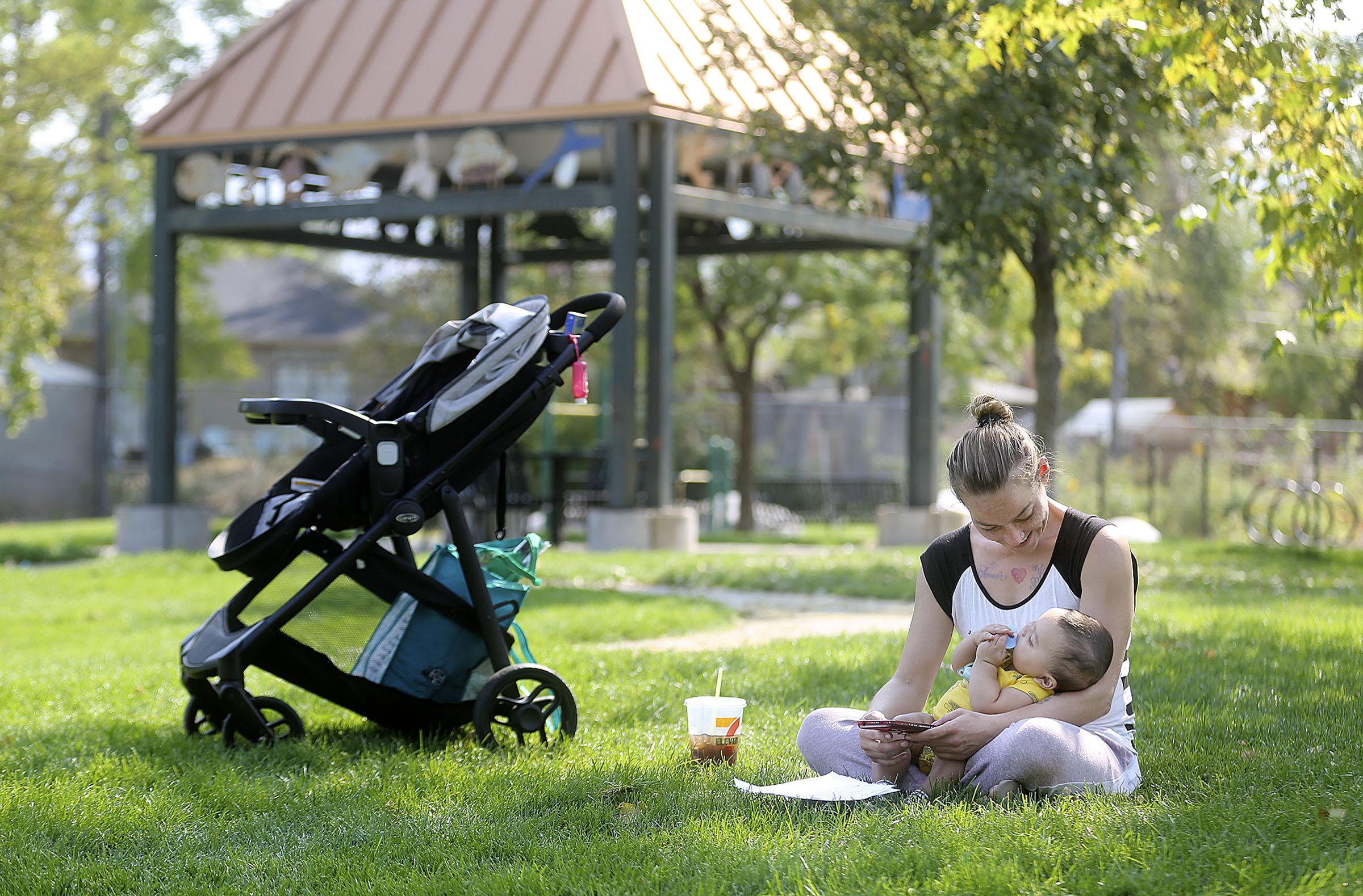 Ashley Bowen cradles son JJ Keola-Stott in Richmond Park in Salt Lake City on Thursday, Sept. 17, 2020. The park is open again after crews cleaned up windstorm debris