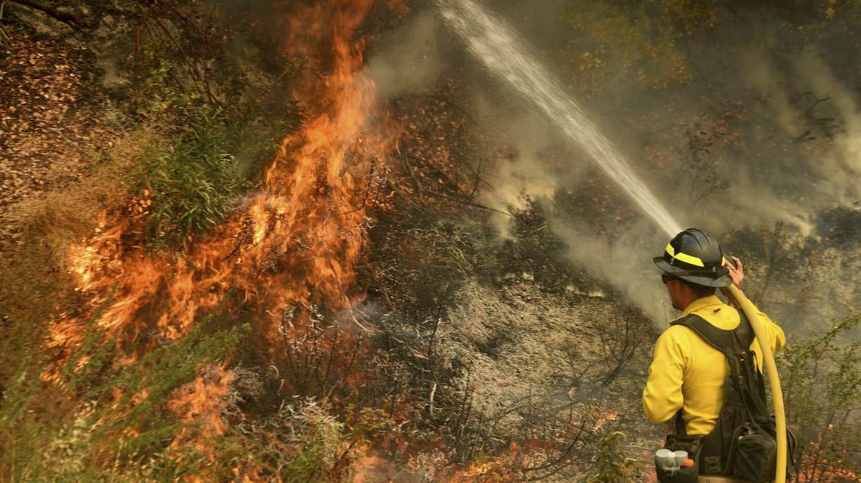 Homes burned as winds push California fire into desert floor
